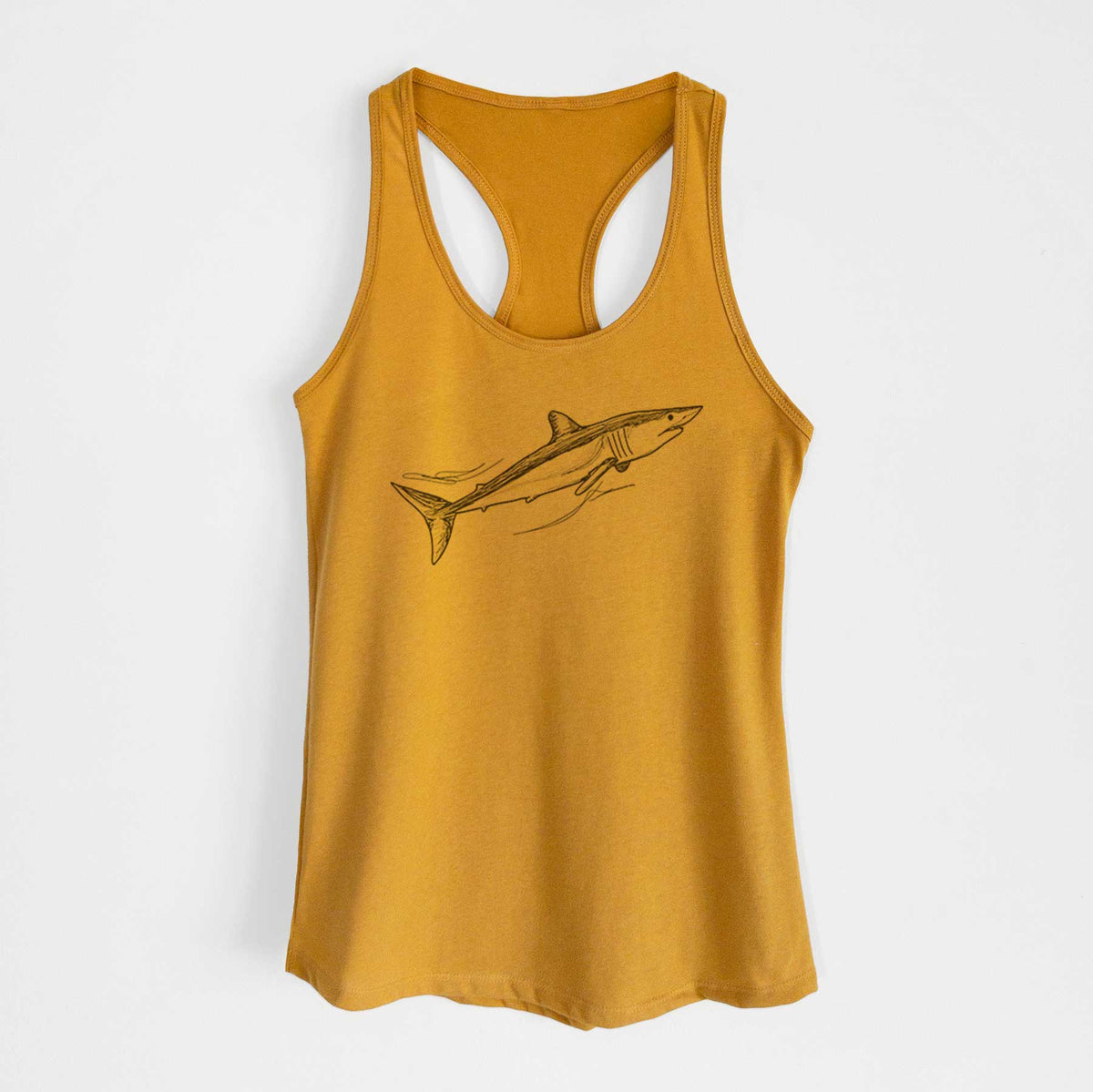 Gold women's racerback tank top laid flat, printed with a black ink illustration of a mako shark swimming.