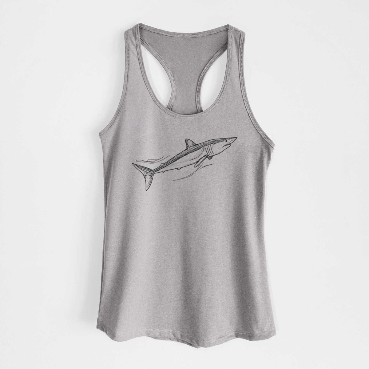 Heather grey women's racerback tank top laid flat, printed with a black ink illustration of a mako shark swimming.