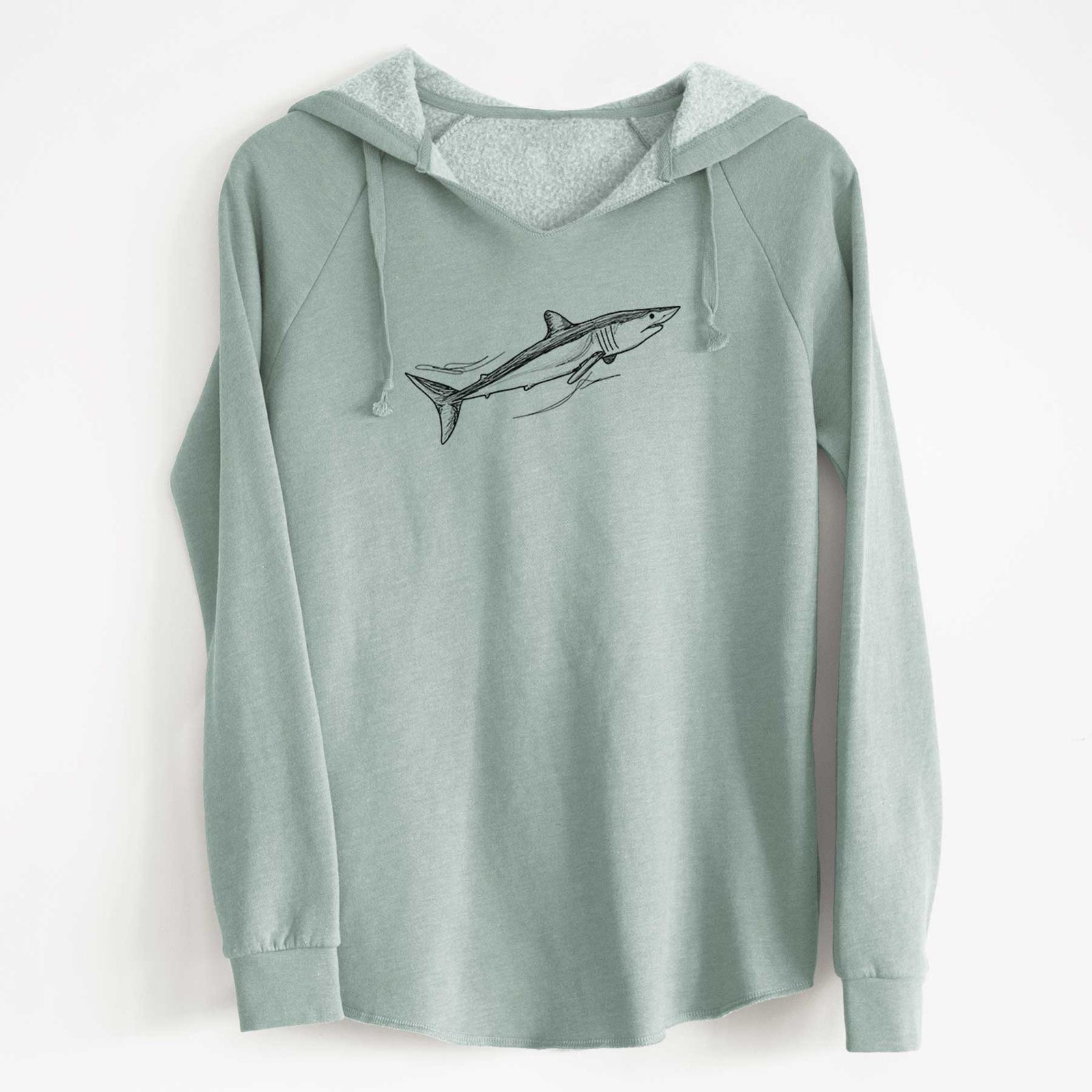 Sage green women's Cali Wave hooded sweatshirt laid flat, printed with a black ink illustration of a mako shark swimming.