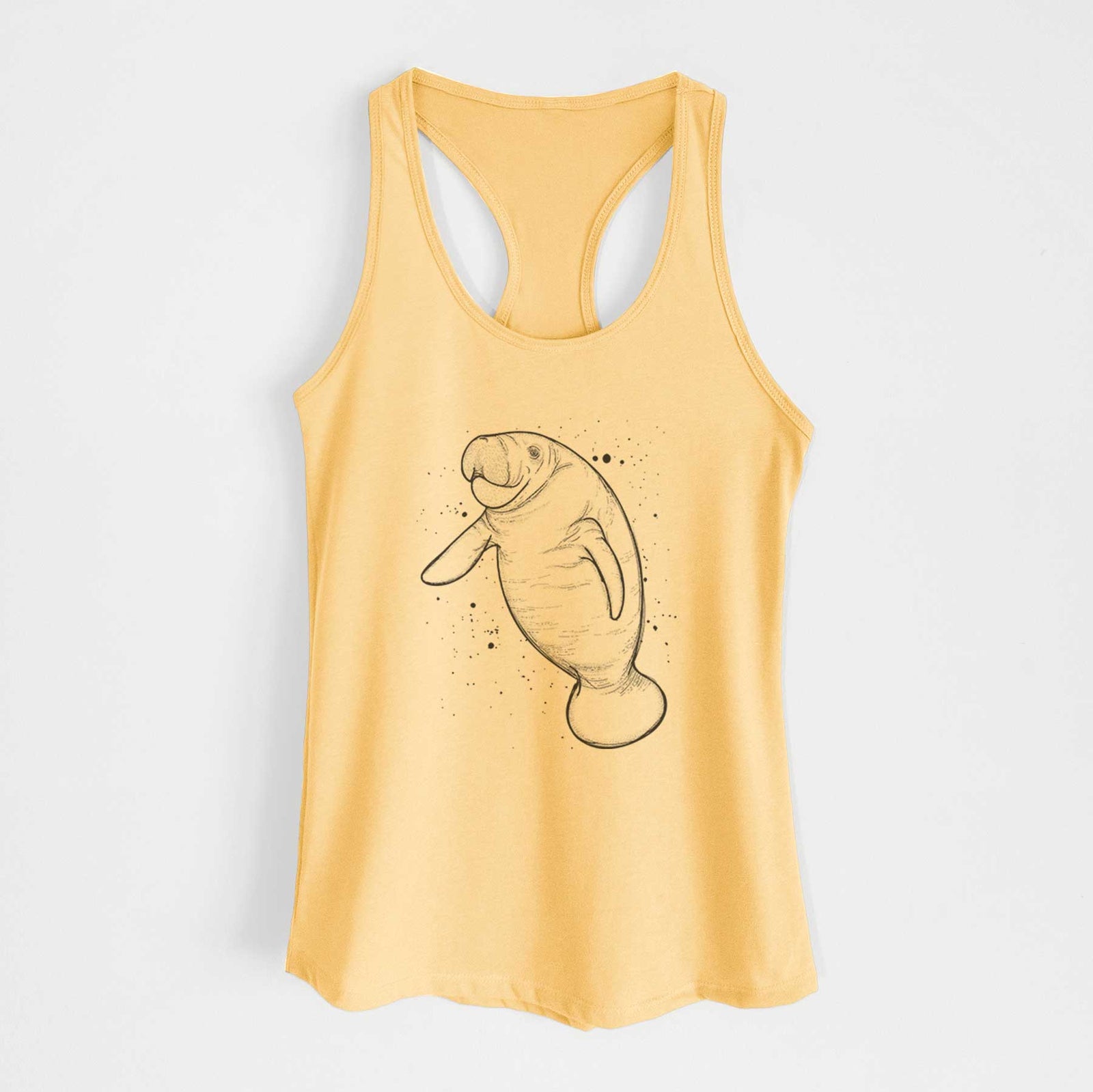 Banana cream women's racerback tank top laid flat, printed with a black ink line drawing of a manatee swimming, with ink splatters.