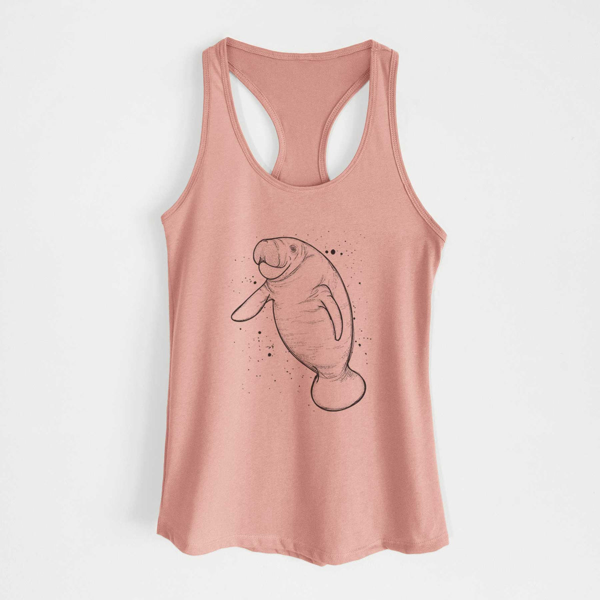 Desert pink women's racerback tank top laid flat, printed with a black ink line drawing of a manatee swimming, with ink splatters.