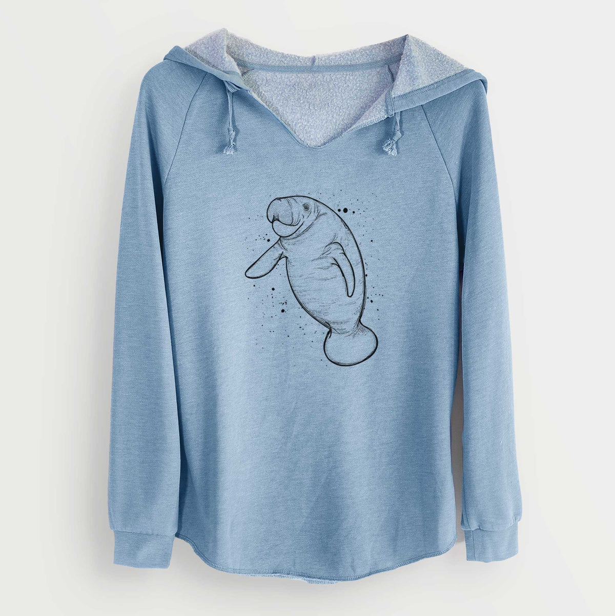 Misty blue women's Cali Wave hooded sweatshirt laid flat, printed with a black ink line drawing of a manatee swimming, with ink splatters.