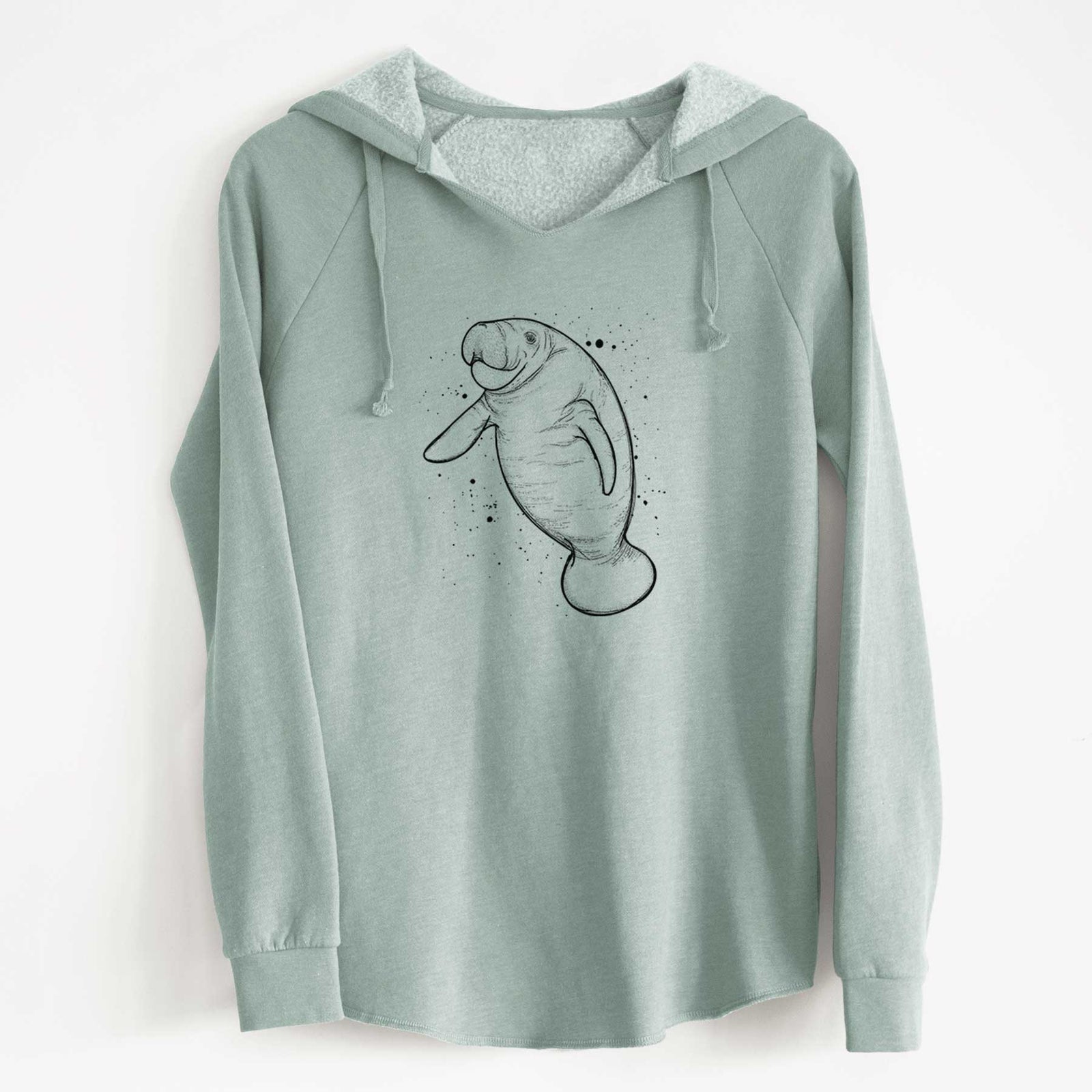 Misty blue women's Cali Wave hooded sweatshirt laid flat, printed with a black ink line drawing of a manatee swimming, with ink splatters.