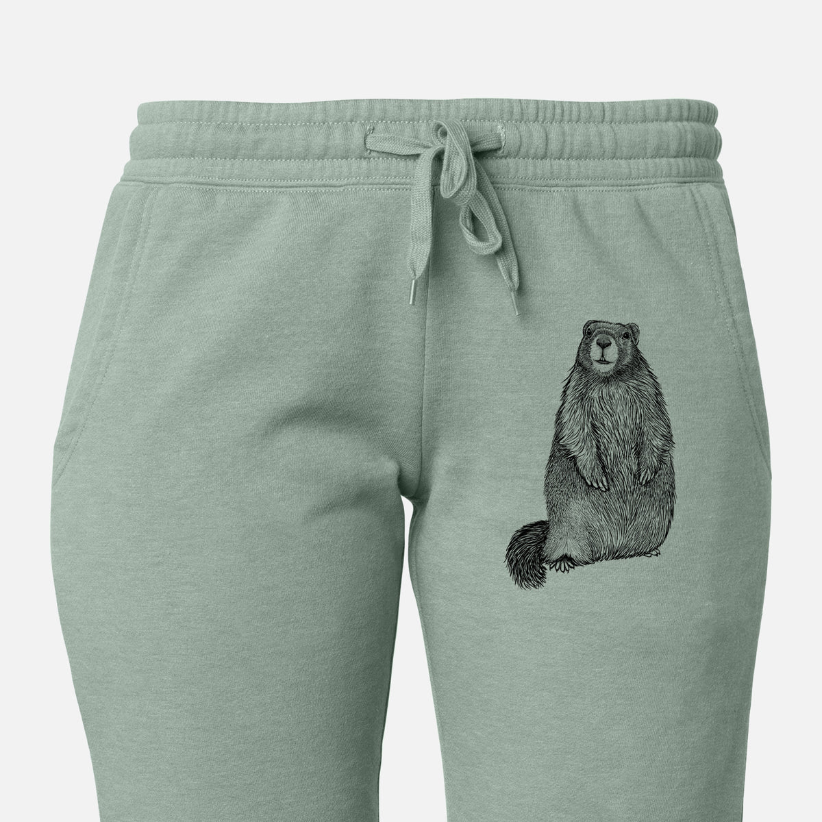 Front of sage green Cali Wave sweatpants, printed with a detailed black ink illustration of a marmot standing upright on the leg.