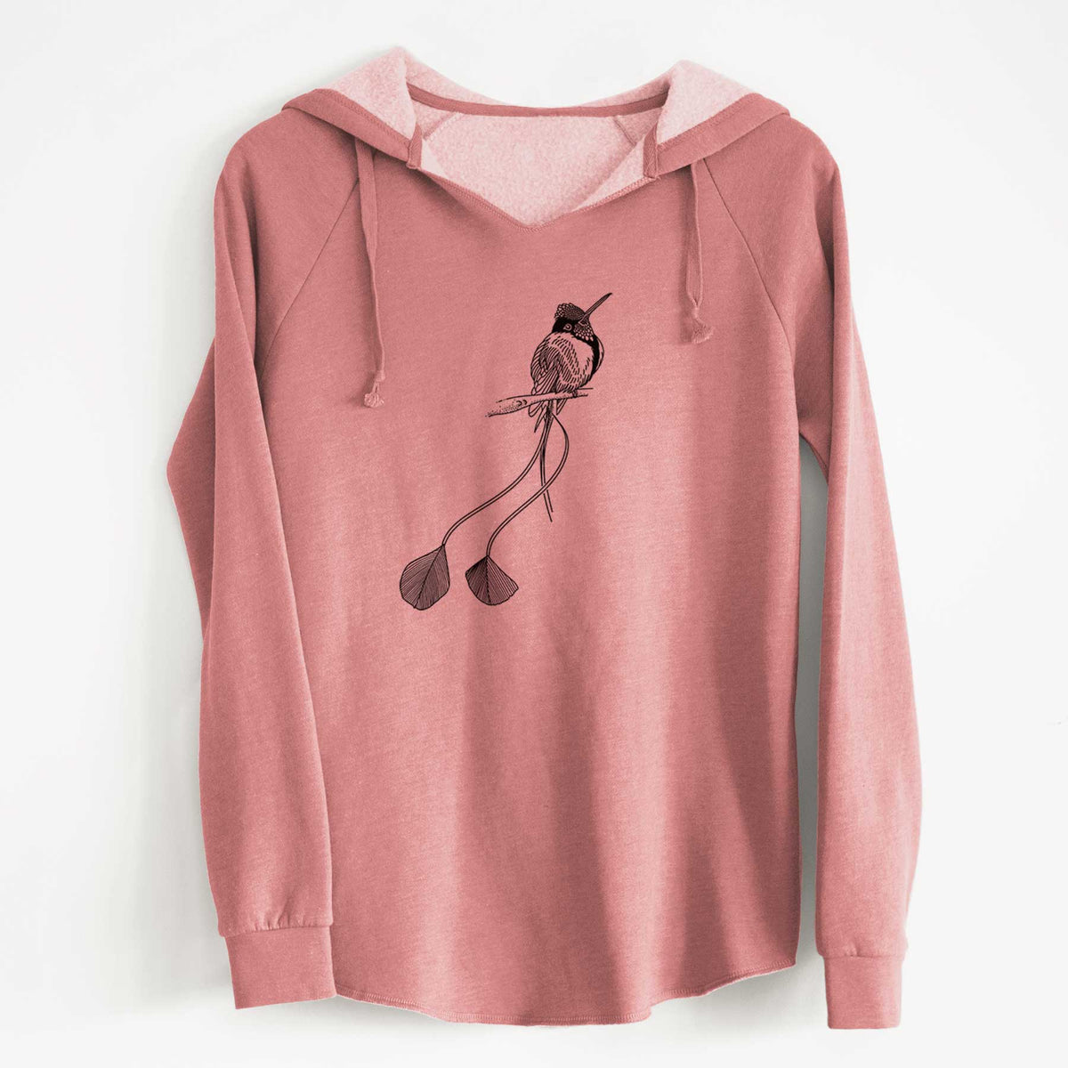 Dusty rose women's Cali Wave hooded sweatshirt laid flat, printed with a black ink illustration of a marvelous spatuletail hummingbird perched, with its two long racket-tipped tail feathers.