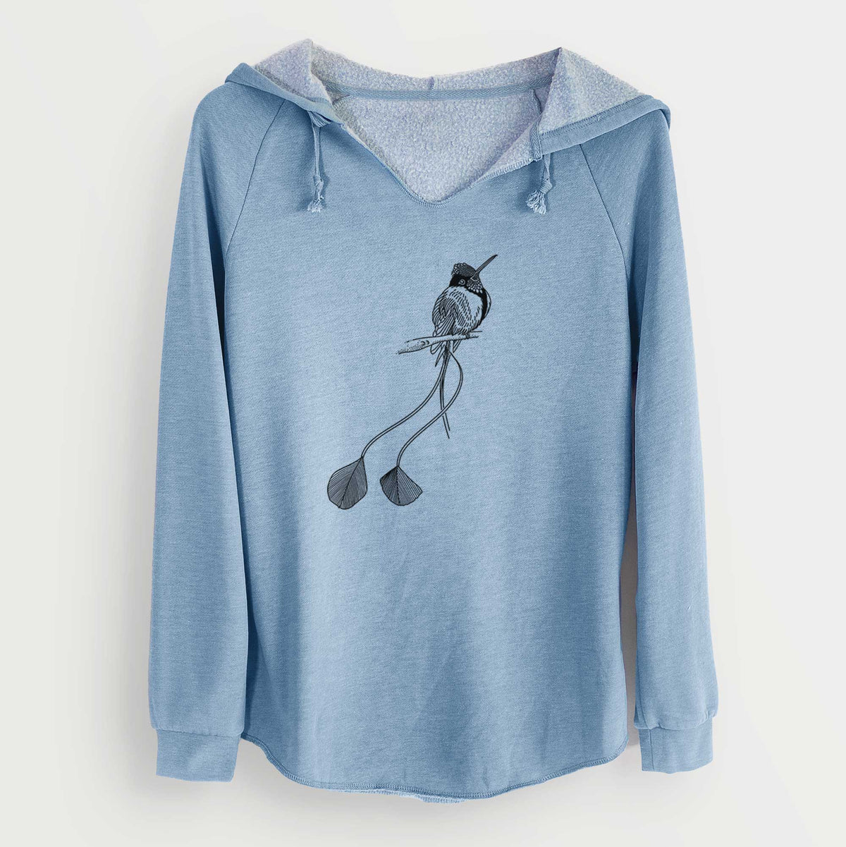 Misty blue women's Cali Wave hooded sweatshirt laid flat, printed with a black ink illustration of a marvelous spatuletail hummingbird perched, with its two long racket-tipped tail feathers.