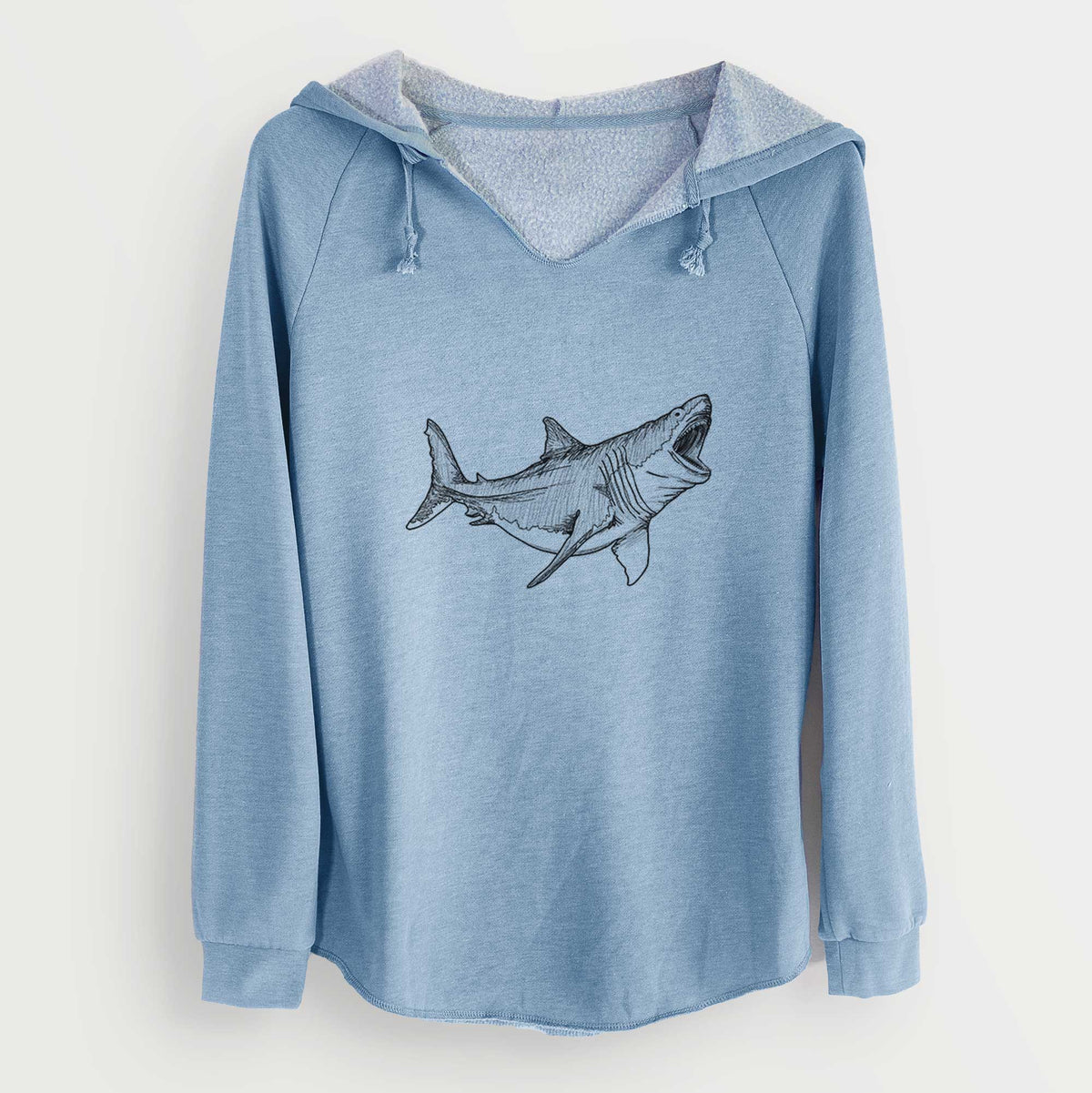 Misty blue women's Cali Wave hooded sweatshirt laid flat, printed with a black ink illustration of a megalodon shark with its jaws open.