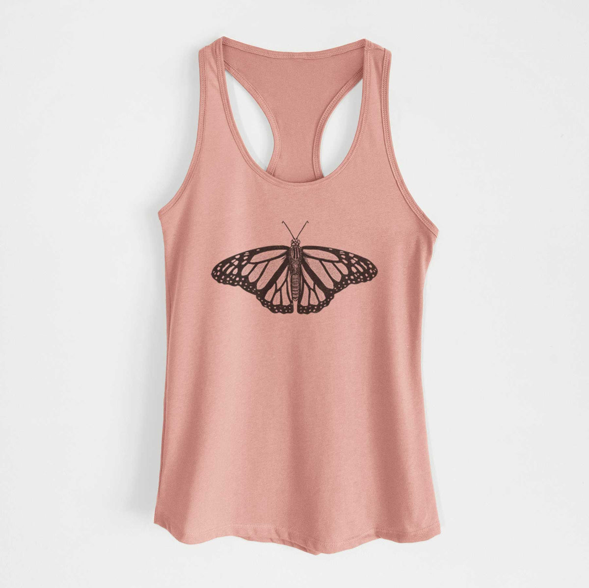 Desert pink women's racerback tank top laid flat, printed with a detailed black ink illustration of a monarch butterfly with its wings spread.