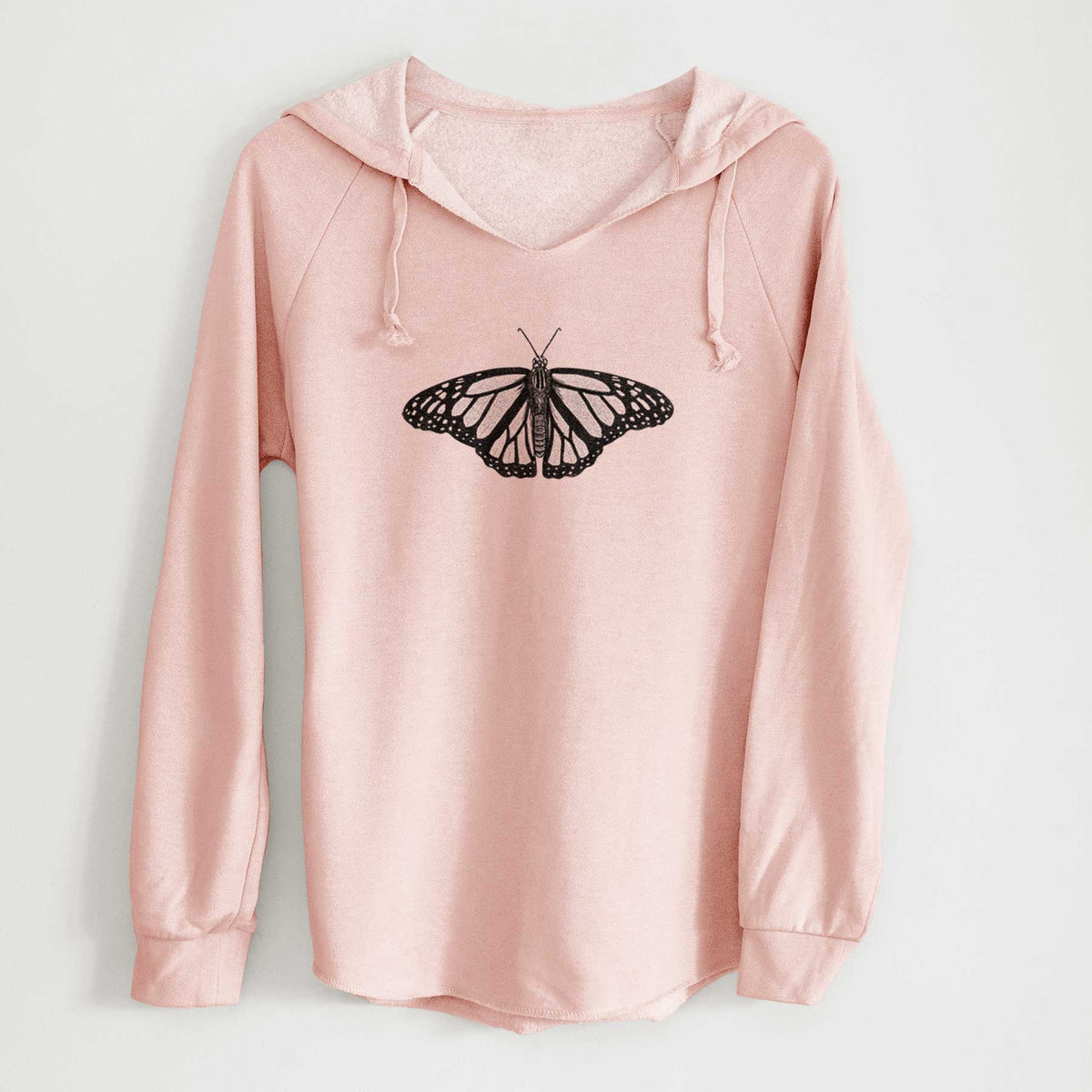 Blush pink women's Cali Wave hooded sweatshirt laid flat, printed with a detailed black ink illustration of a monarch butterfly with its wings spread.