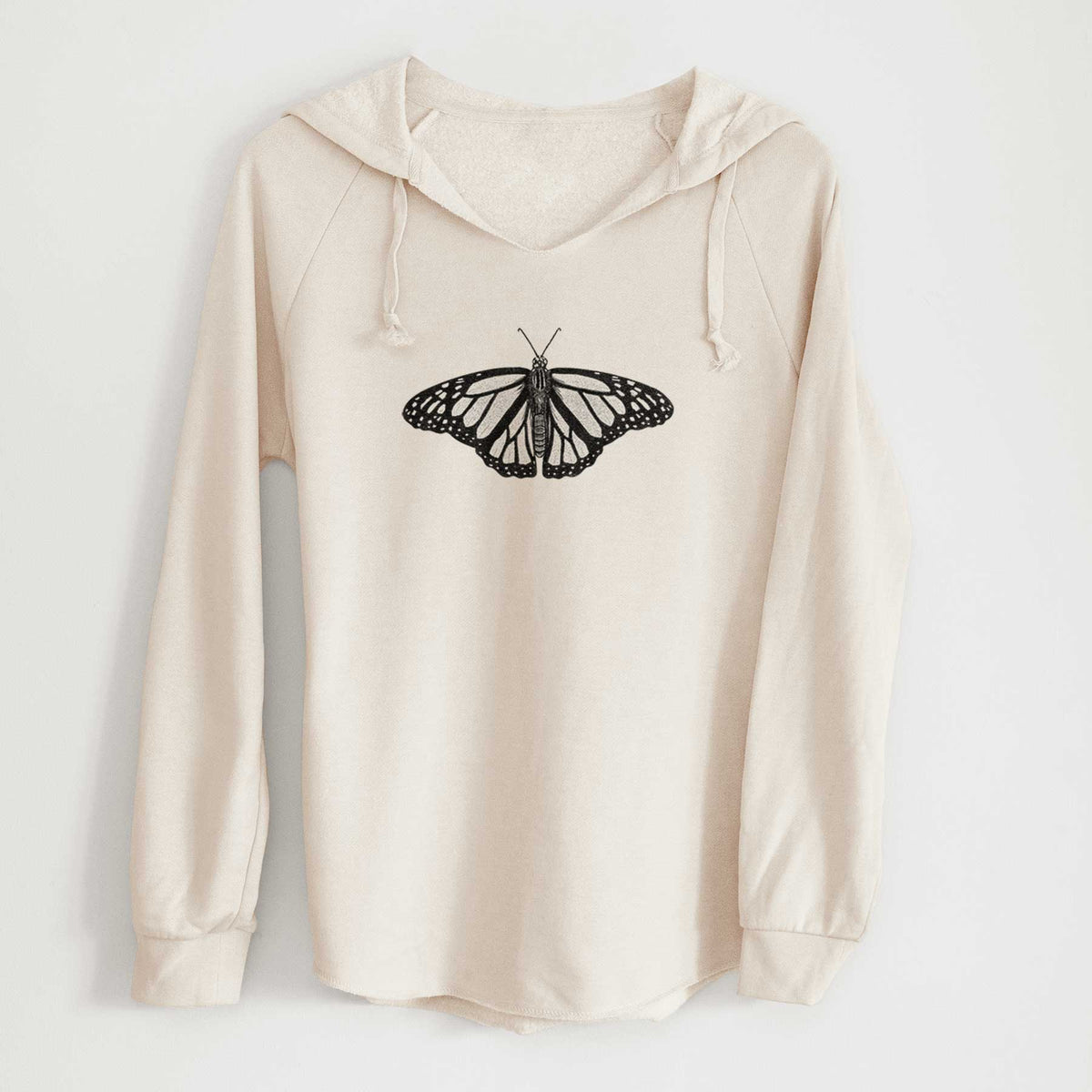 Bone cream women's Cali Wave hooded sweatshirt laid flat, printed with a detailed black ink illustration of a monarch butterfly with its wings spread.
