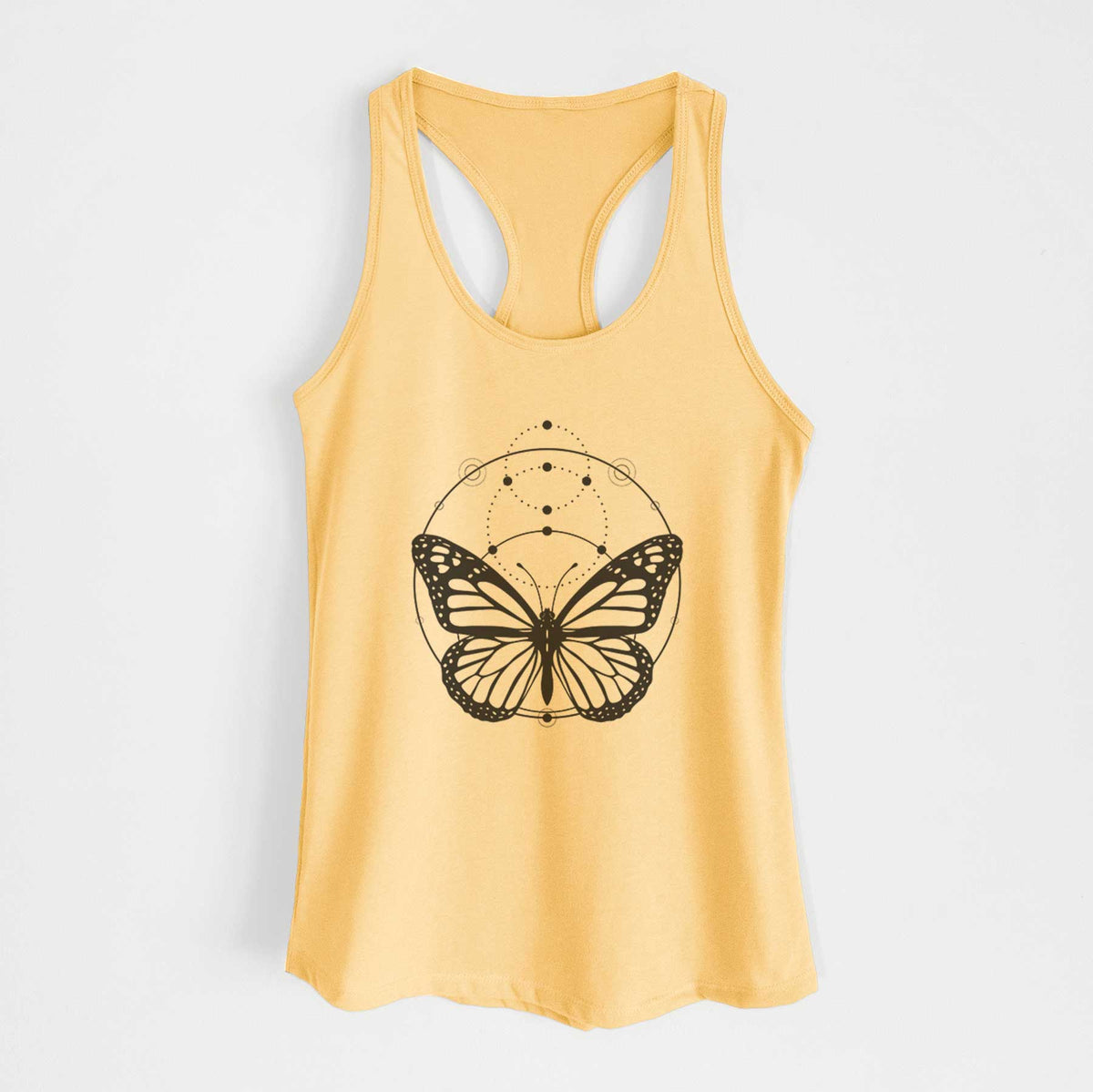 Banana cream women's racerback tank top laid flat, printed with a black ink monarch butterfly inside a circle, beneath a line of moon phases.