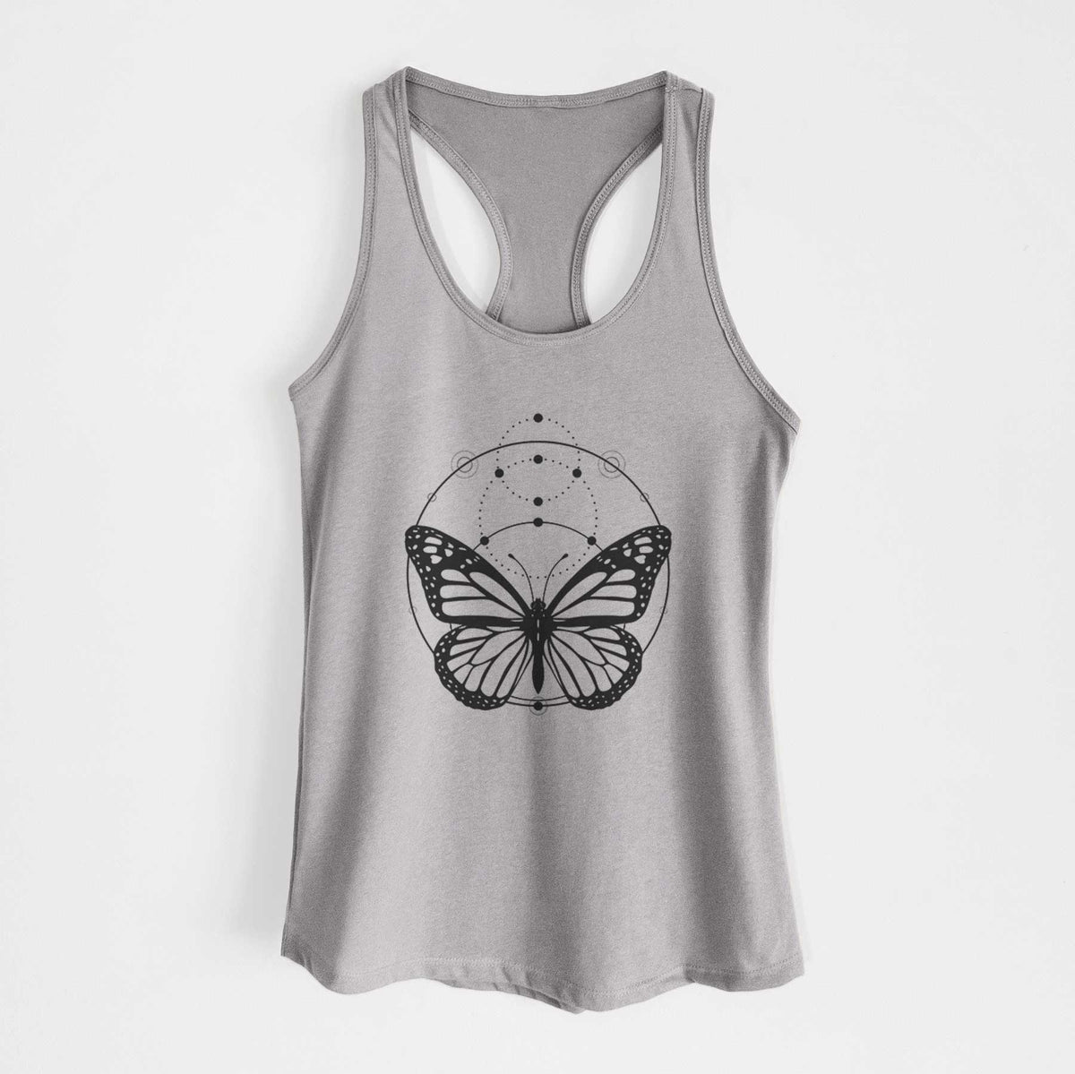 Heather grey women's racerback tank top laid flat, printed with a black ink monarch butterfly inside a circle, beneath a line of moon phases.