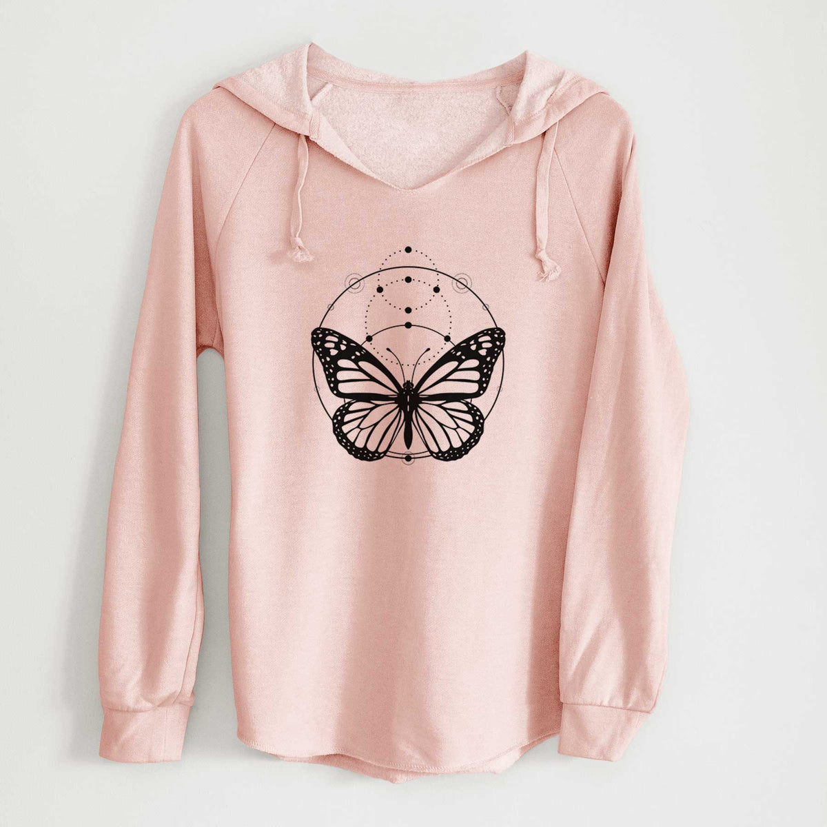 Blush pink women's Cali Wave hooded sweatshirt laid flat, printed with a black ink monarch butterfly inside a circle, beneath a line of moon phases.