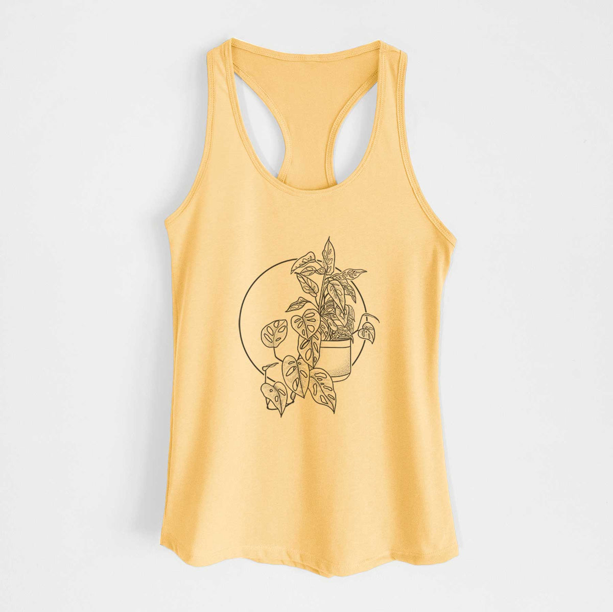 Banana cream women's racerback tank top laid flat, printed with a black ink illustration of a potted Monsteradansonii plant with trailing vines in front of a circle.
