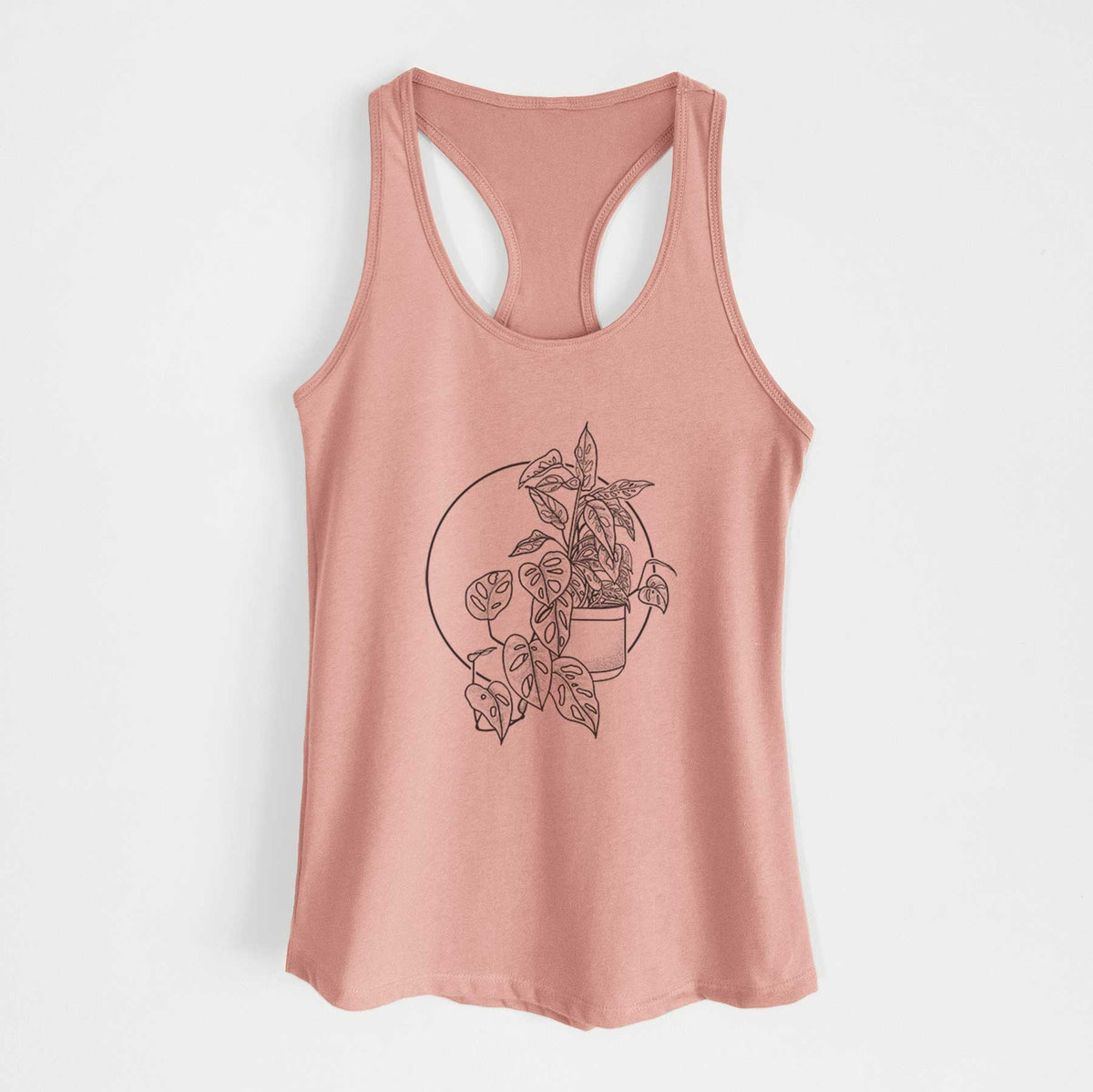 Desert pink women's racerback tank top laid flat, printed with a black ink illustration of a potted Monsteradansonii plant with trailing vines in front of a circle.