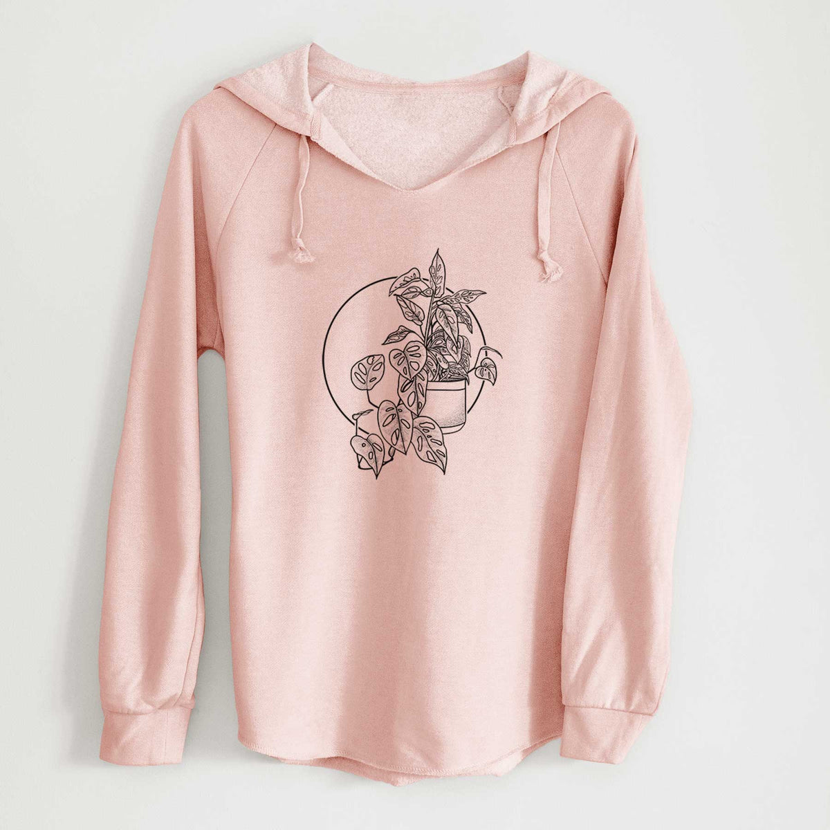 Blush pink women's Cali Wave hooded sweatshirt laid flat, printed with a black ink illustration of a potted Monsteradansonii plant with trailing vines in front of a circle.