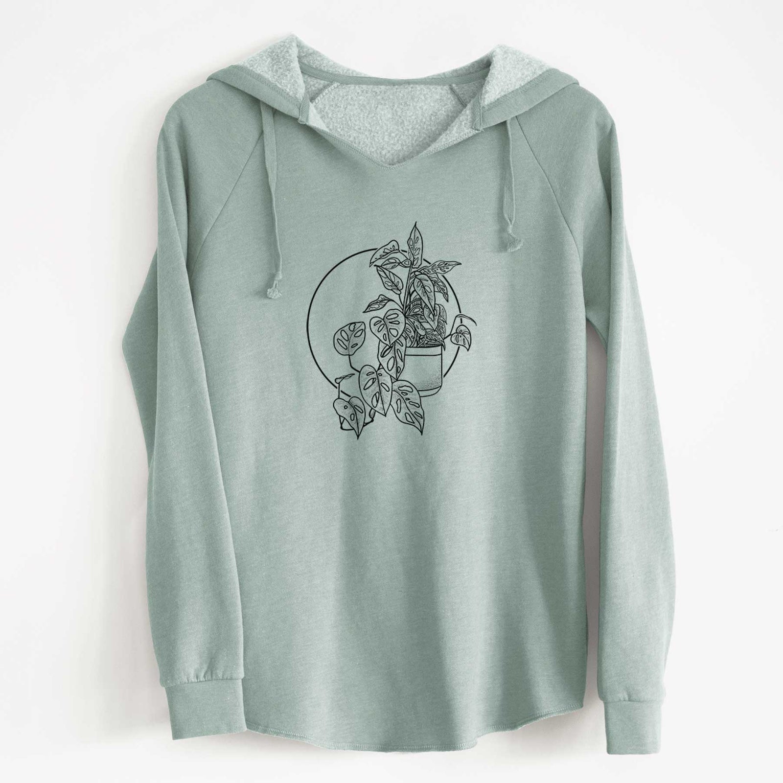 Sage green women's Cali Wave hooded sweatshirt laid flat, printed with a black ink illustration of a potted Monsteradansonii plant with trailing vines in front of a circle.