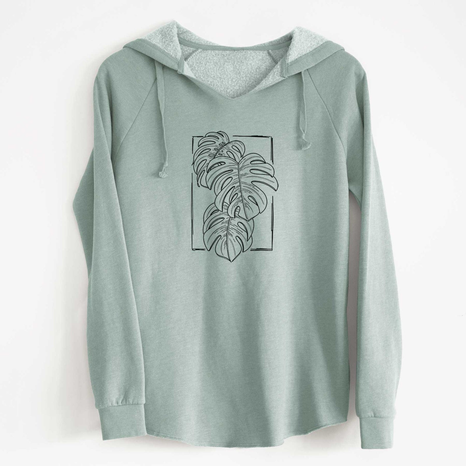 Sage green women's Cali Wave hooded sweatshirt laid flat, printed with a black ink line drawing of Monstera deliciosa leaves inside a rectangle outline.