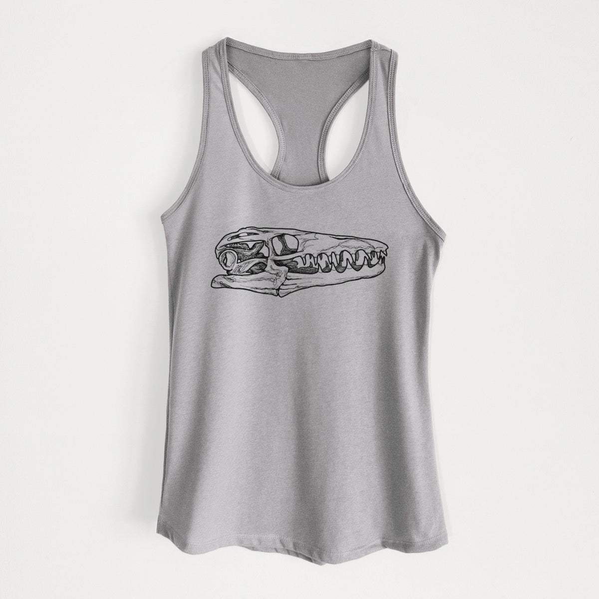 Heather grey women's racerback tank top laid flat, printed with a detailed black ink illustration of a Mosasaur skull.