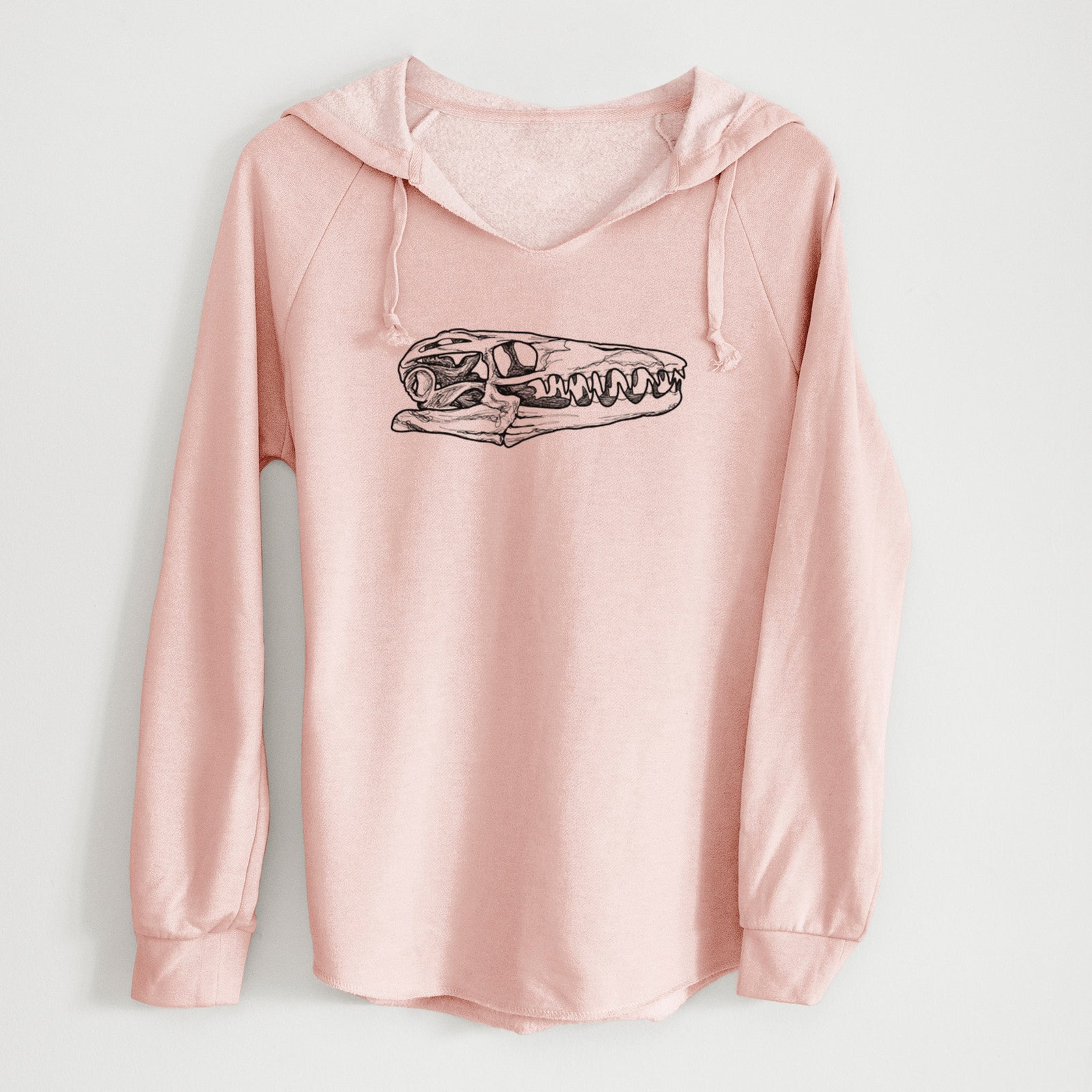 Sage green women's Cali Wave hooded sweatshirt laid flat, printed with a detailed black ink illustration of a Mosasaur skull.