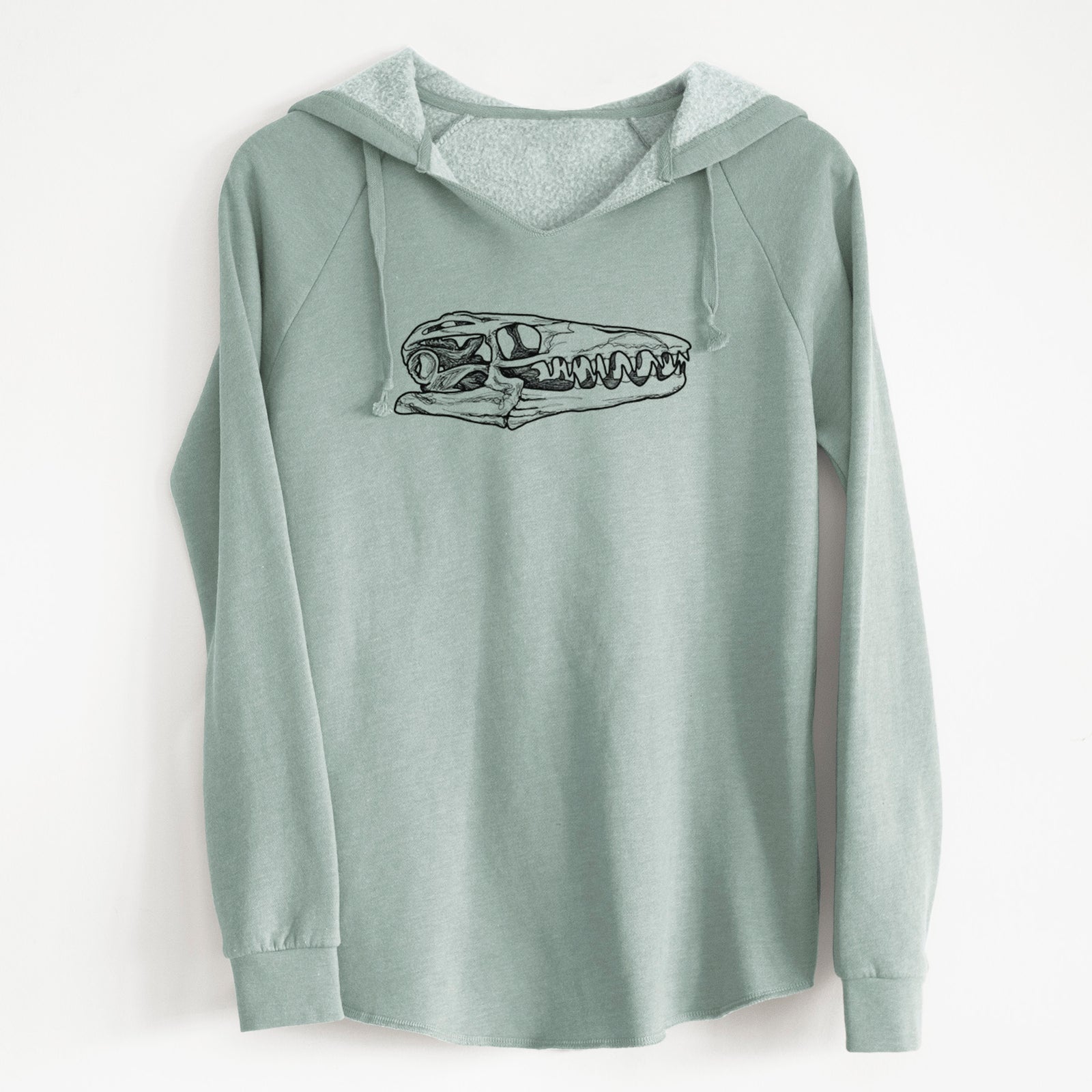 Sage green women's Cali Wave hooded sweatshirt laid flat, printed with a detailed black ink illustration of a Mosasaur skull.