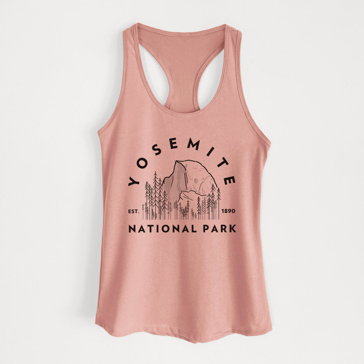 Desert pink women's racerback tank top laid flat, printed with a round badge of Half Dome and pine trees, with the words Yosemite National Park, Est. 1890.