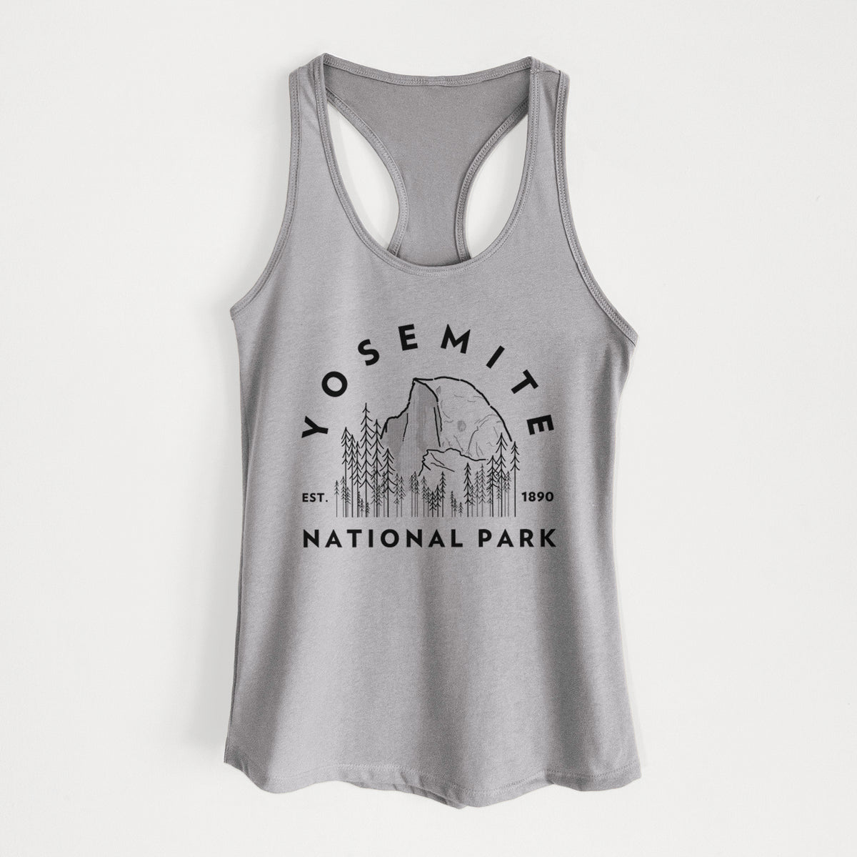 Heather grey women's racerback tank top laid flat, printed with a round badge of Half Dome and pine trees, with the words Yosemite National Park, Est. 1890.