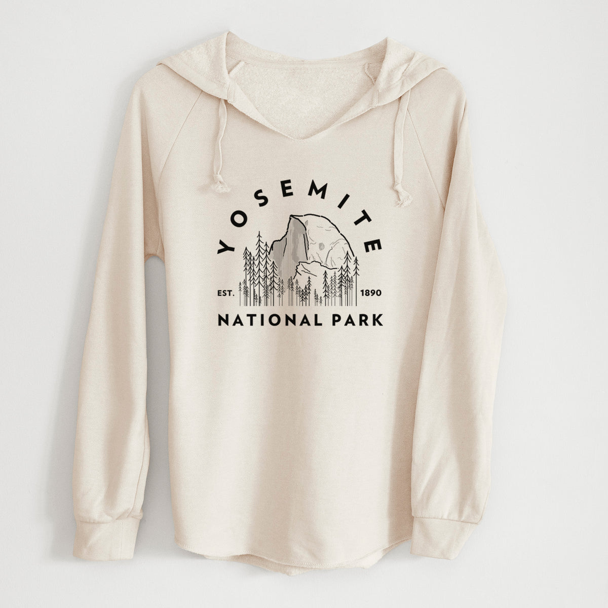 Bone cream women's Cali Wave hooded sweatshirt laid flat, printed with a round badge of Half Dome and pine trees, with the words Yosemite National Park, Est. 1890.