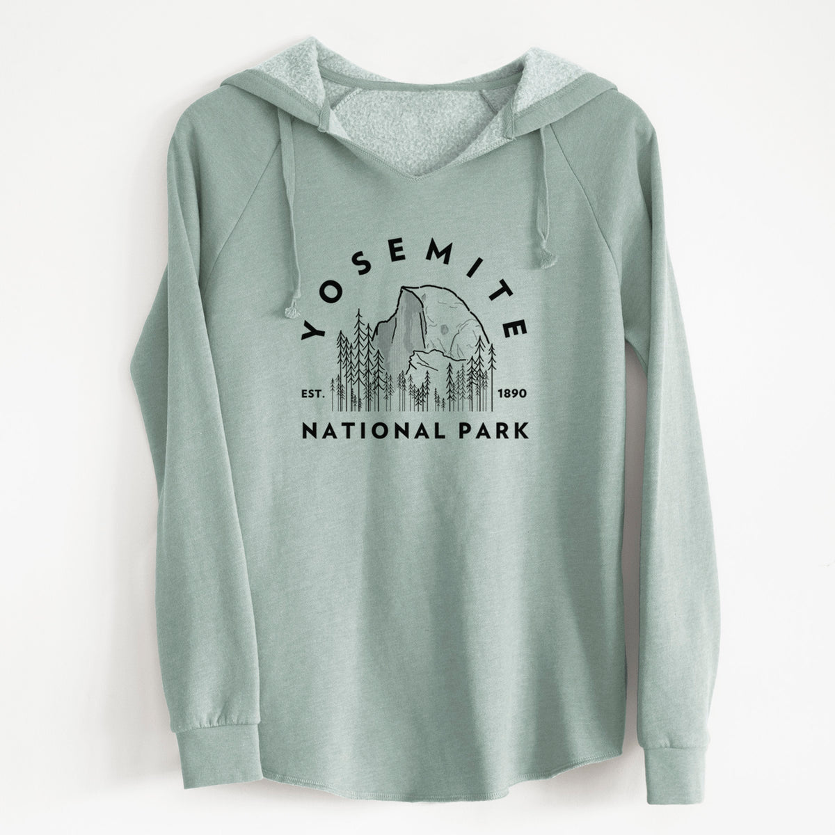 Sage green women's Cali Wave hooded sweatshirt laid flat, printed with a round badge of Half Dome and pine trees, with the words Yosemite National Park, Est. 1890.