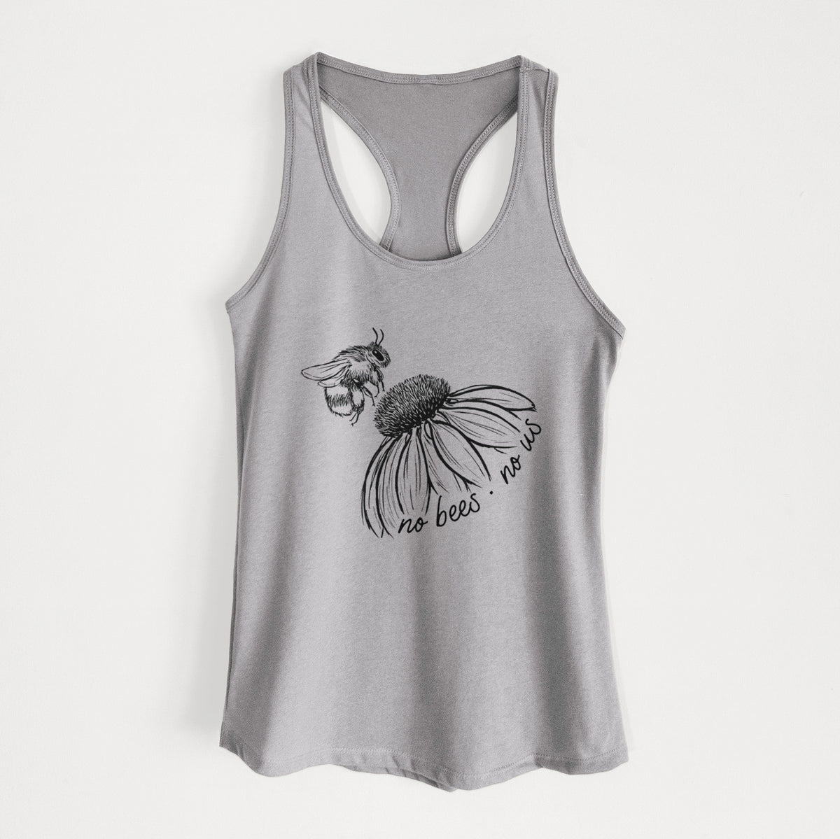 Heather grey women's racerback tank top laid flat, printed with a black ink illustration of a bee flying toward a coneflower, with the handwritten words no bees no us.