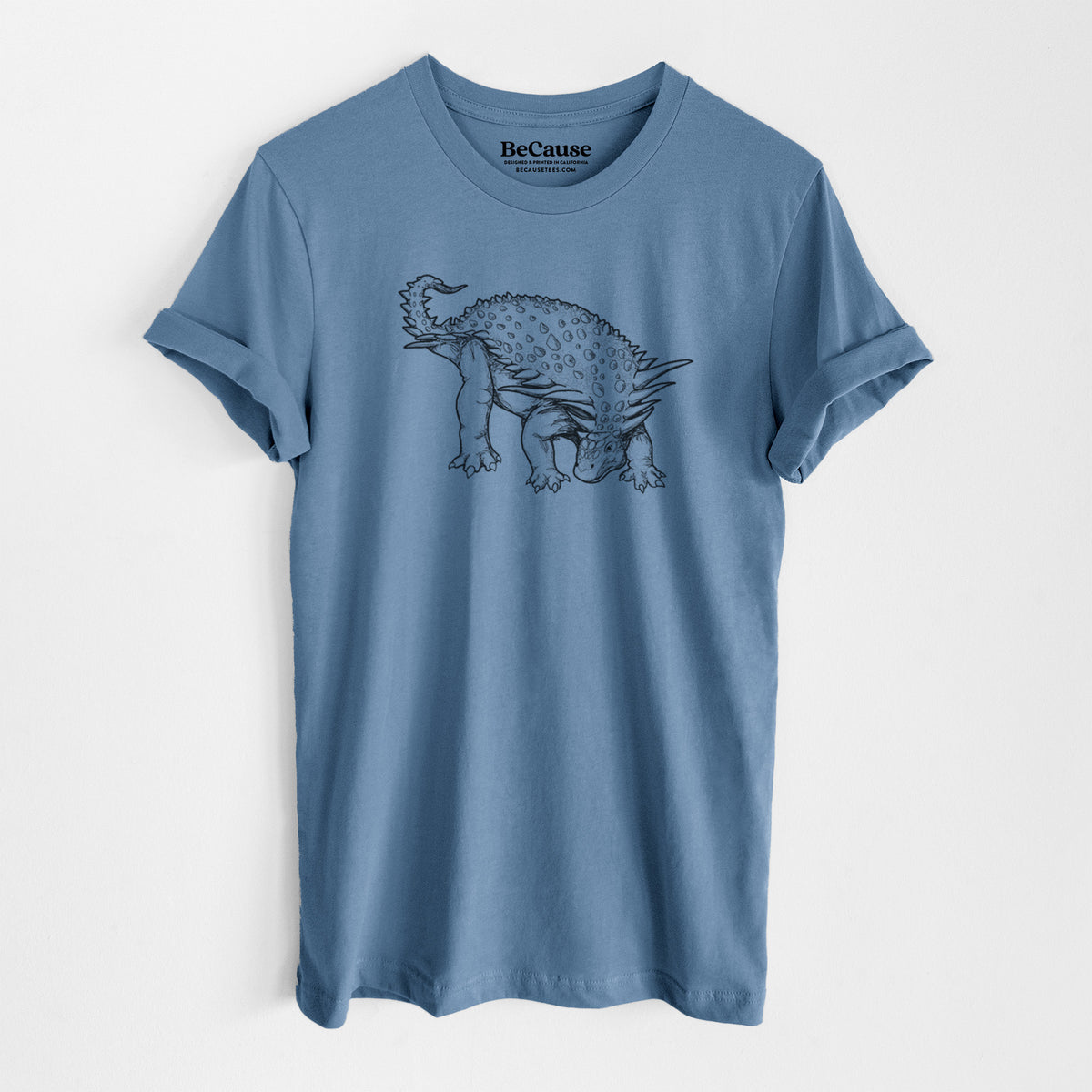 Steel blue lightweight cotton t-shirt laid flat, printed with a black ink illustration of an armored Nodosaurus.