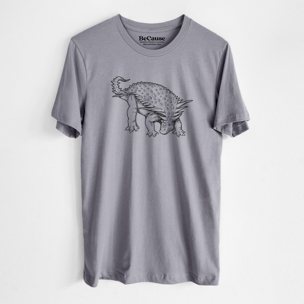 Storm grey lightweight cotton t-shirt laid flat, printed with a black ink illustration of an armored Nodosaurus.