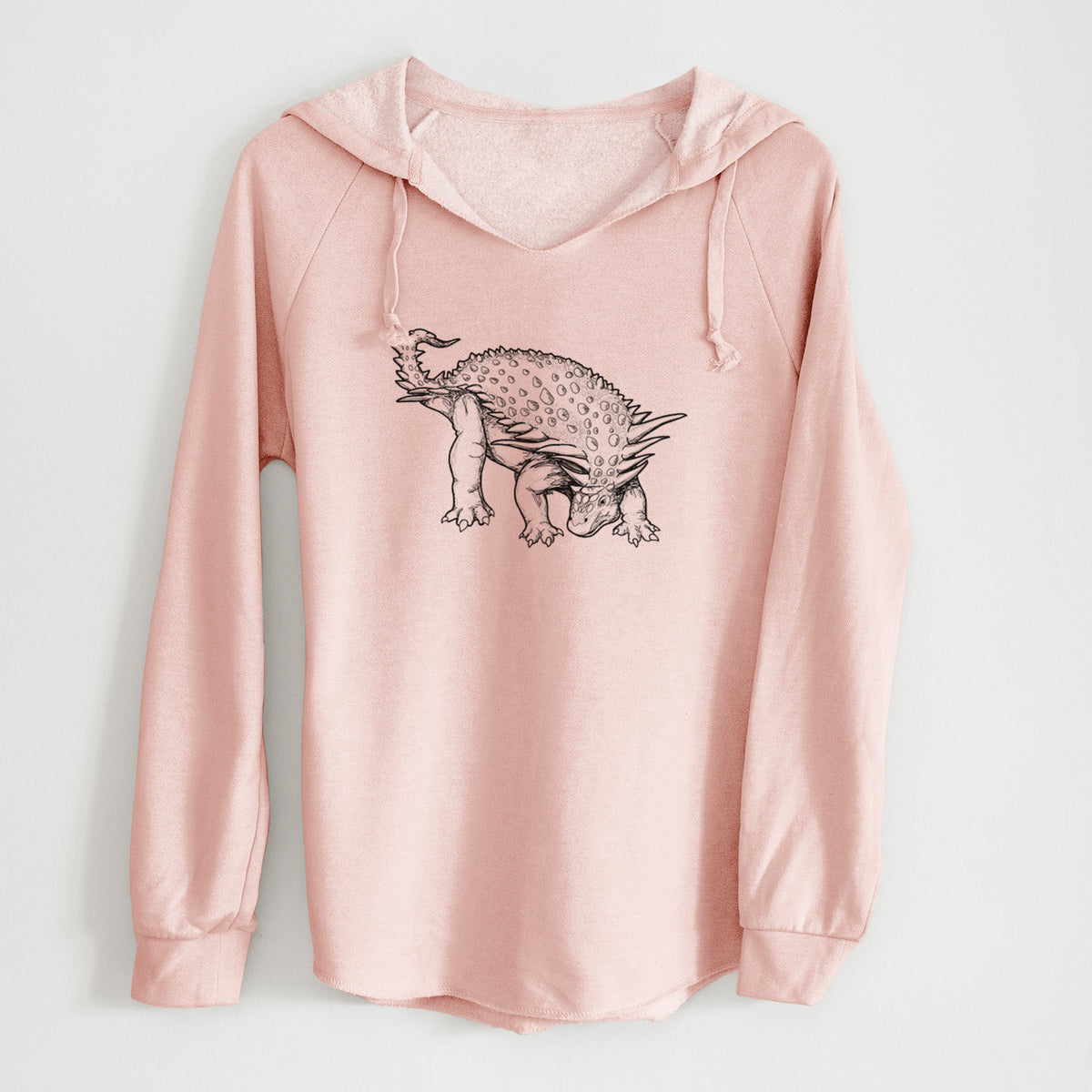 Blush pink women's Cali Wave hooded sweatshirt laid flat, printed with a black ink illustration of an armored Nodosaurus.