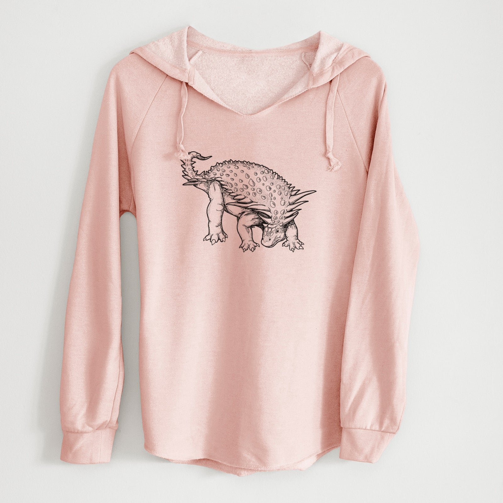 Sage green women's Cali Wave hooded sweatshirt laid flat, printed with a black ink illustration of an armored Nodosaurus.