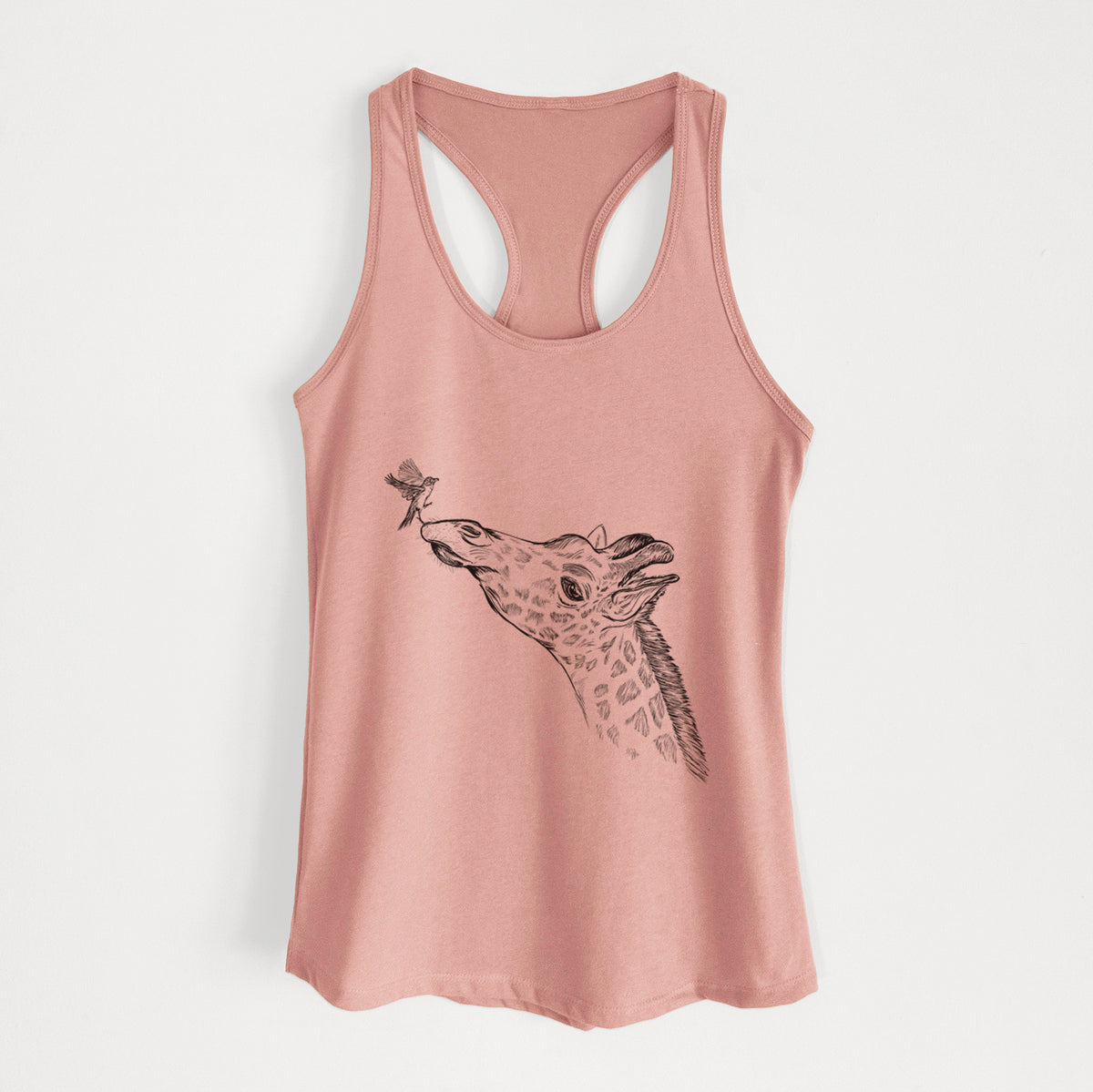 Desert pink women's racerback tank top laid flat, printed with a black ink illustration of a northern giraffe reaching its head up to nibble a flower.