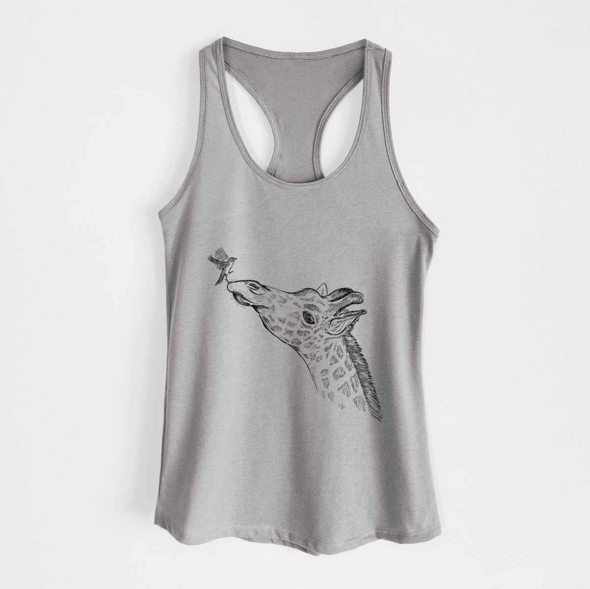Heather grey women's racerback tank top laid flat, printed with a black ink illustration of a northern giraffe reaching its head up to nibble a flower.