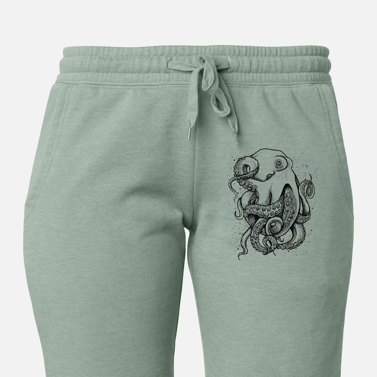 Front of sage green Cali Wave sweatpants, printed with a detailed black ink illustration of a common octopus with curling tentacles on the leg.