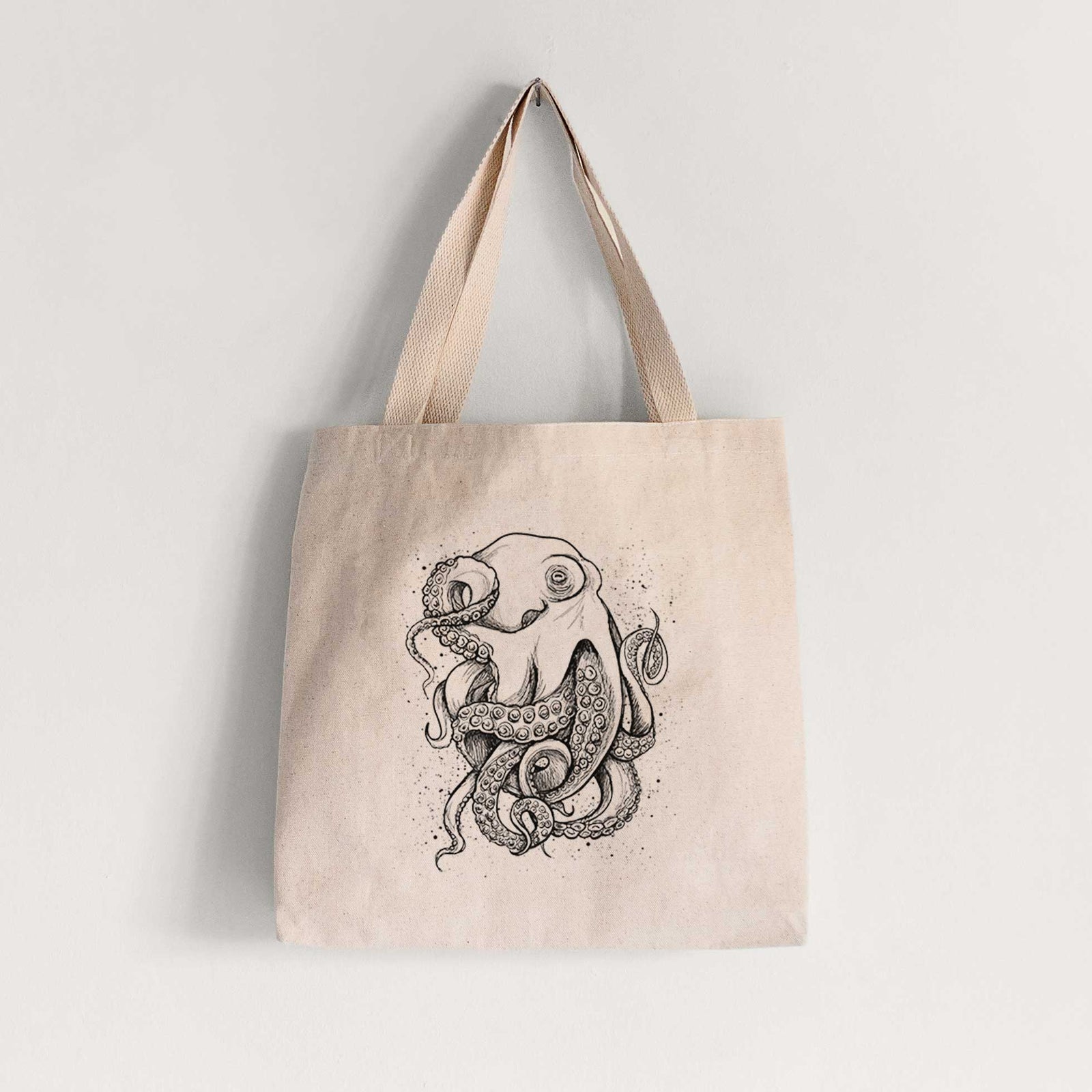 Natural canvas tote bag printed with a detailed black ink illustration of a common octopus with curling tentacles.