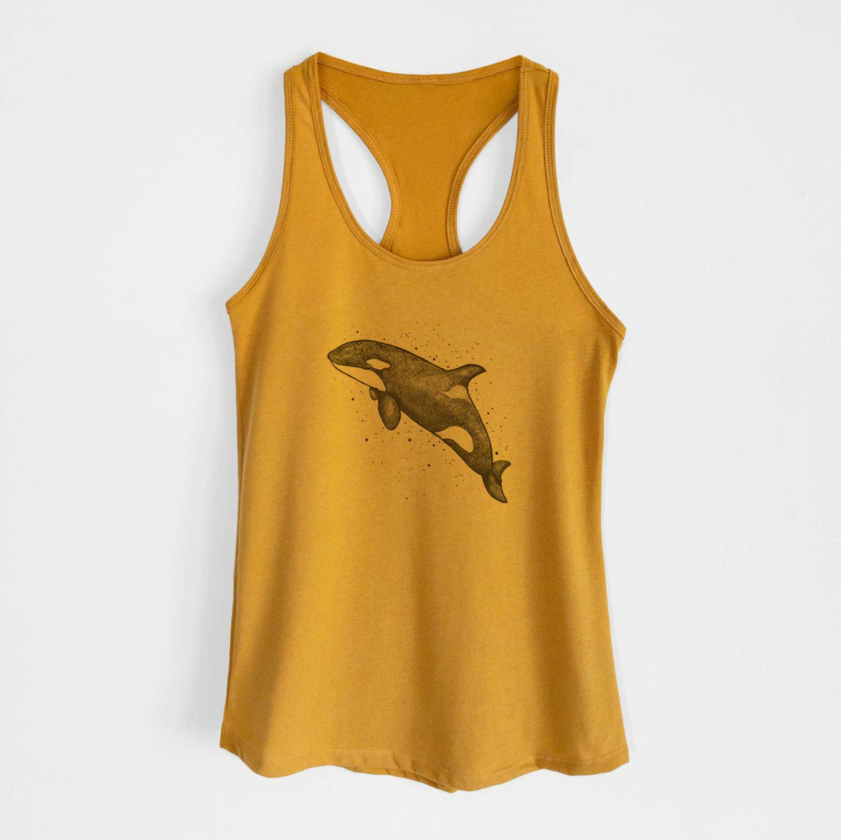 Gold women's racerback tank top laid flat, printed with a black ink illustration of an orca leaping, with ink splatters.