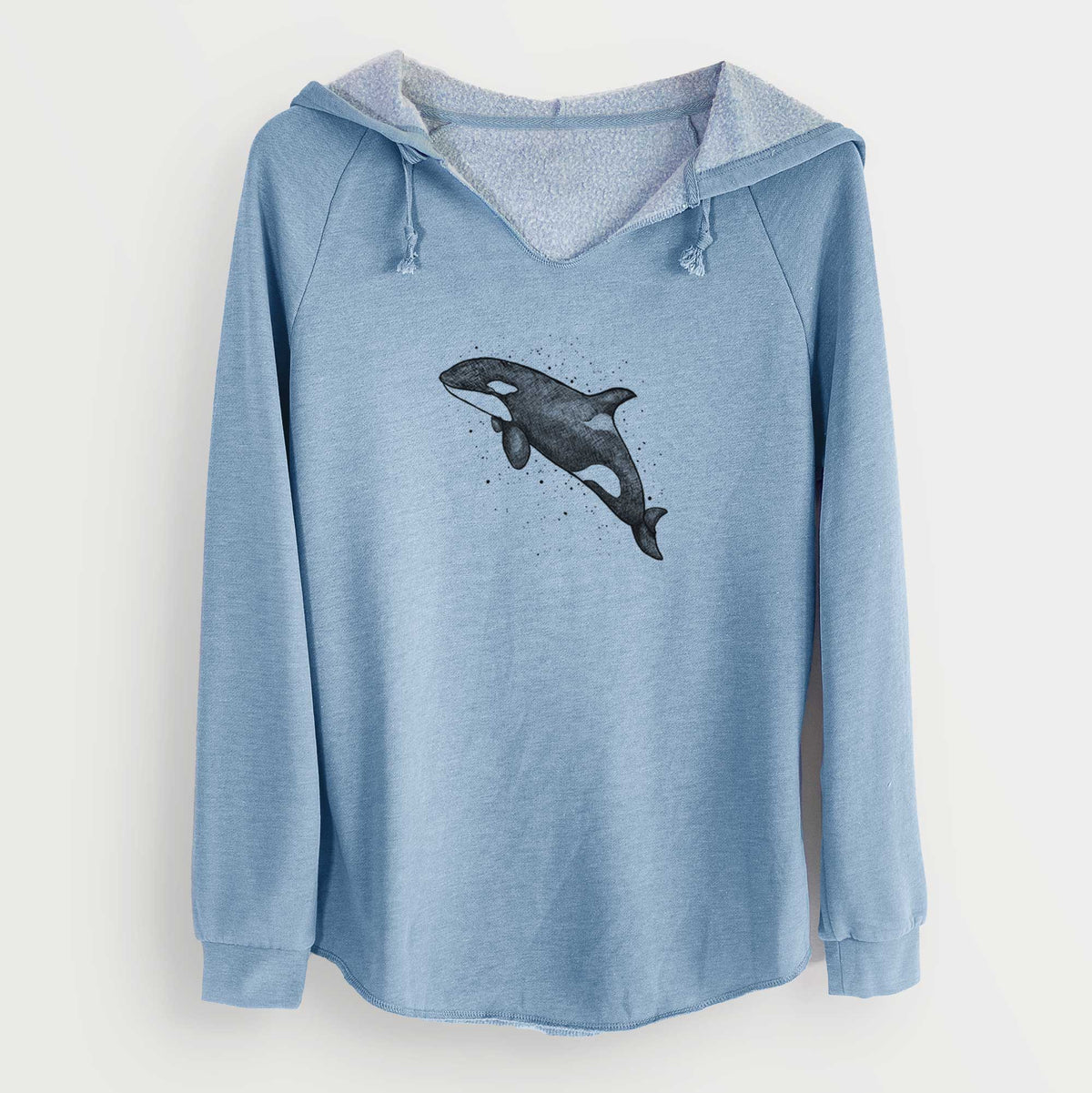 Misty blue women's Cali Wave hooded sweatshirt laid flat, printed with a black ink illustration of an orca leaping, with ink splatters.