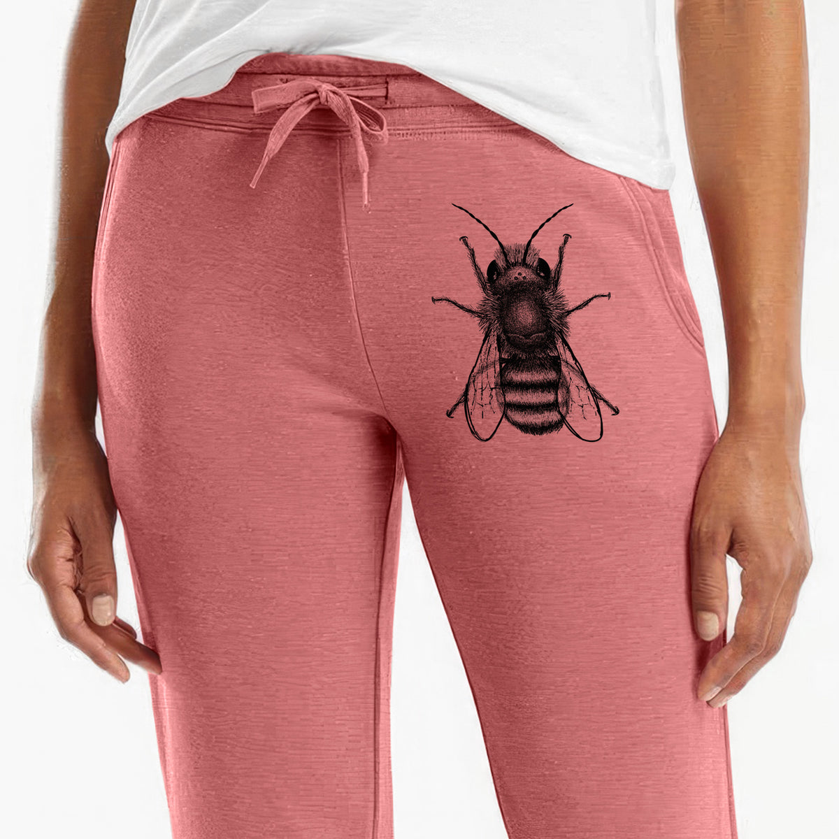 Front of dusty rose Cali Wave sweatpants, printed with a detailed black ink illustration of a red mason bee with its wings spread, seen from above on the leg.