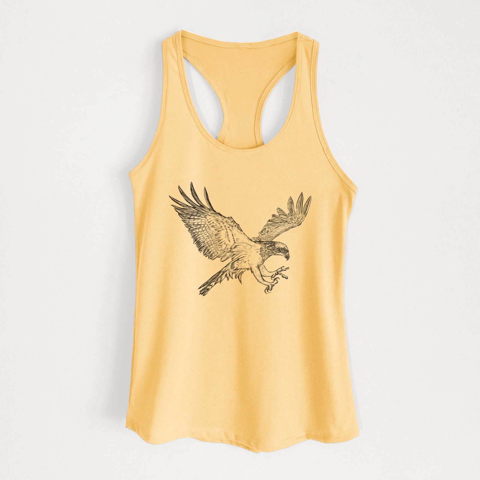 Banana cream women's racerback tank top laid flat, printed with a black ink illustration of an osprey in flight with its wings spread.