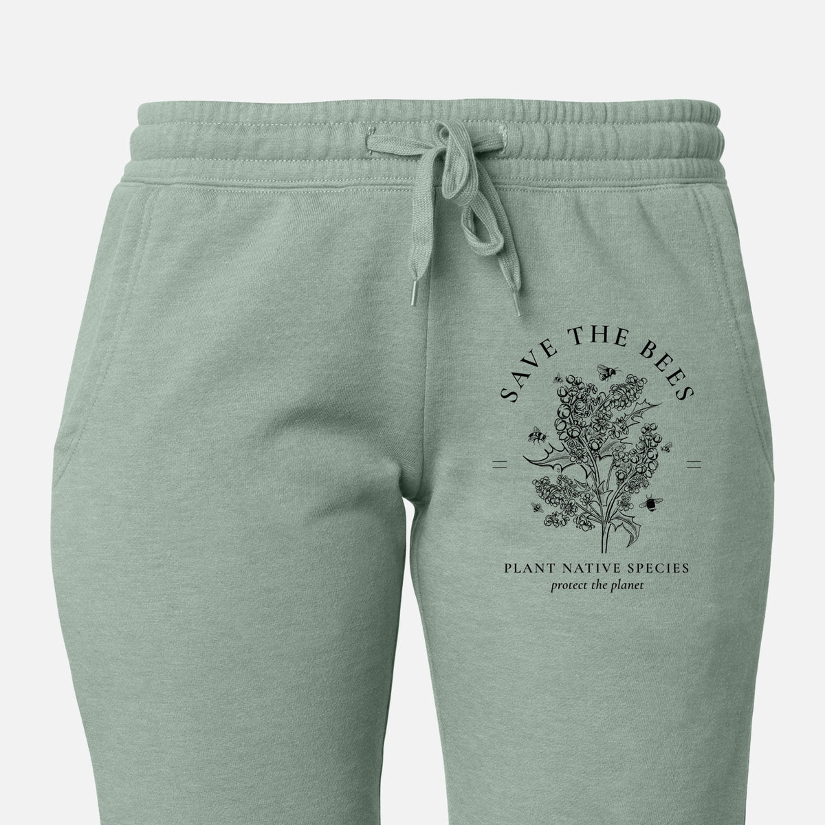 Front of sage green Cali Wave sweatpants, printed with a black ink wildflower bouquet with bees, framed by the words Save the Bees, Plant Native Species on the leg.