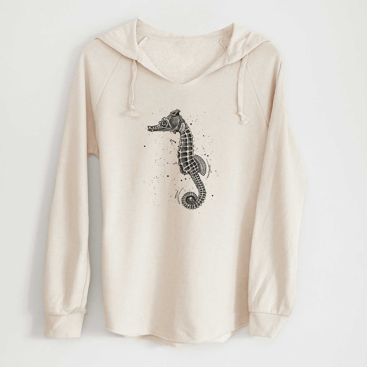 Bone cream women's Cali Wave hooded sweatshirt laid flat, printed with a detailed black ink illustration of a Pacific seahorse with its tail curled.