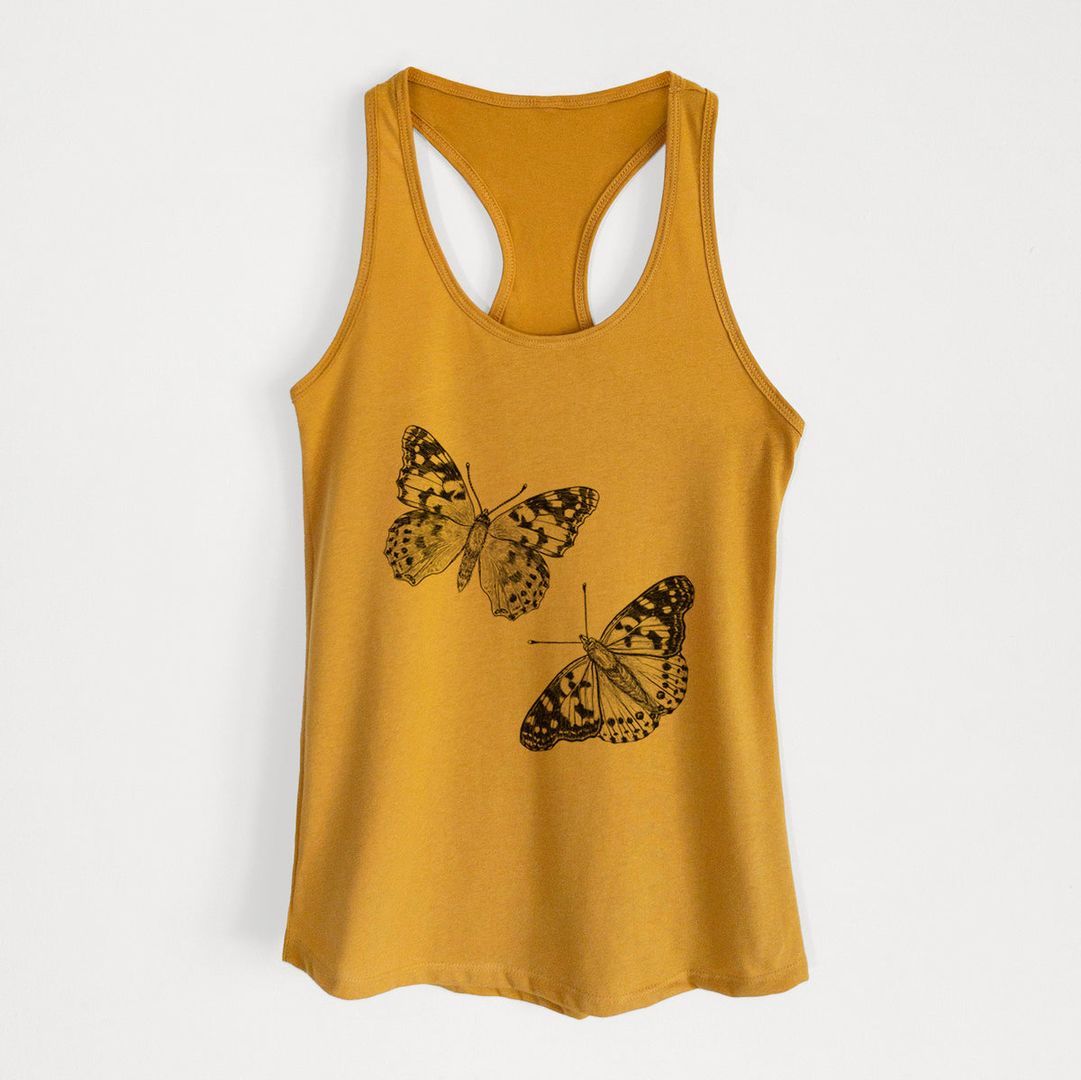 Gold women's racerback tank top laid flat, printed with a detailed black ink illustration of two painted lady butterflies.