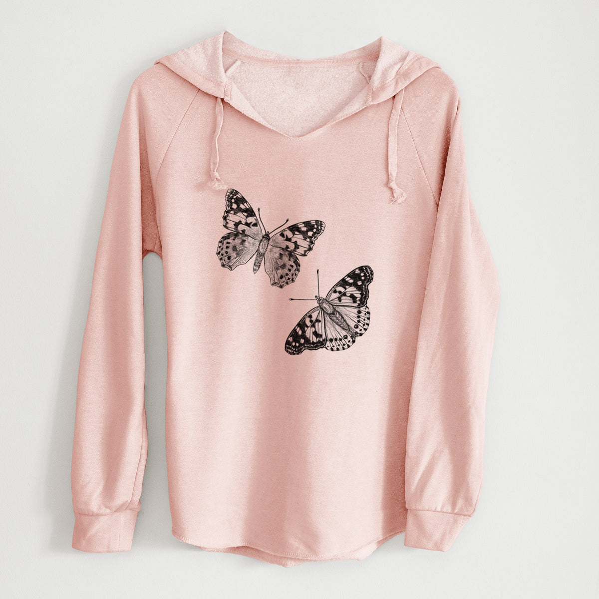 Blush pink women's Cali Wave hooded sweatshirt laid flat, printed with a detailed black ink illustration of two painted lady butterflies.