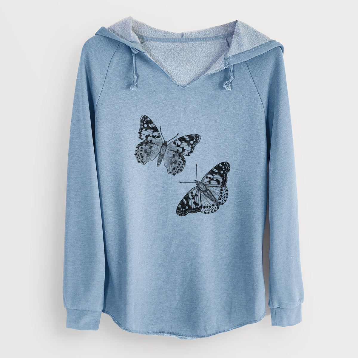 Misty blue women's Cali Wave hooded sweatshirt laid flat, printed with a detailed black ink illustration of two painted lady butterflies.