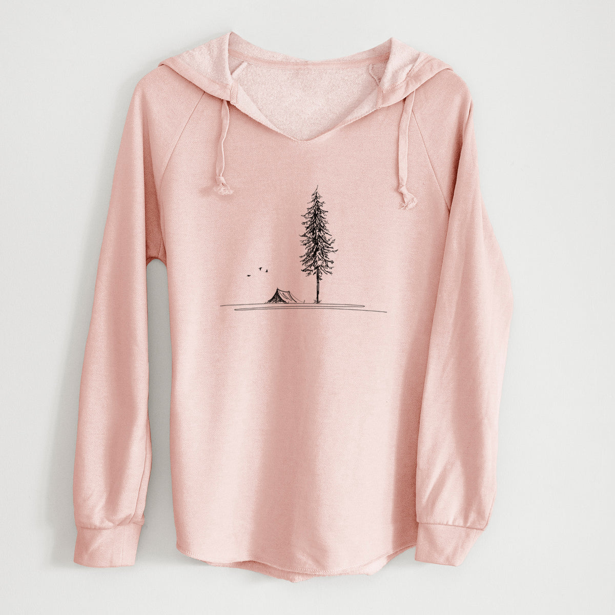 Blush pink women's Cali Wave hooded sweatshirt laid flat, printed with a black ink illustration of a tall pine tree beside a small tent on a hill.