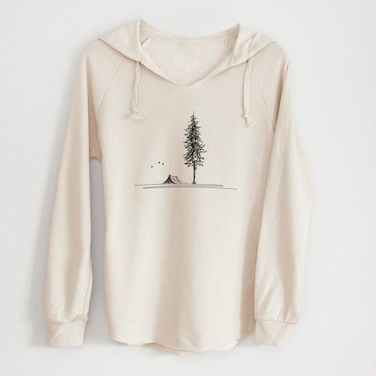 Bone cream women's Cali Wave hooded sweatshirt laid flat, printed with a black ink illustration of a tall pine tree beside a small tent on a hill.