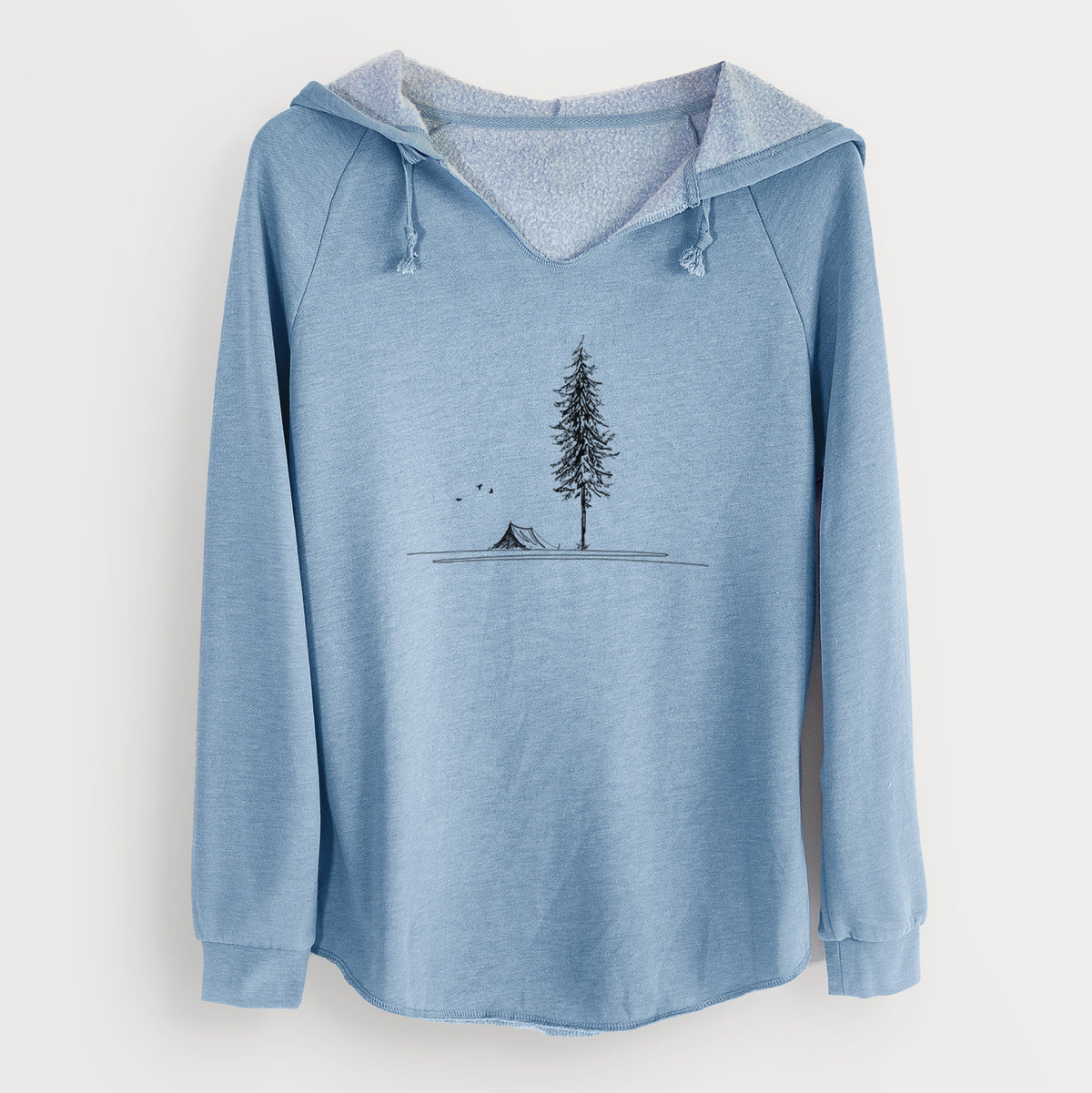 Misty blue women's Cali Wave hooded sweatshirt laid flat, printed with a black ink illustration of a tall pine tree beside a small tent on a hill.